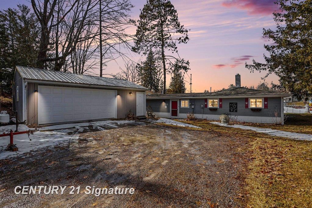 Escape to your own private slice of Northern Michigan paradise! Tucked away on a peaceful cul-de-sac along a quiet cove, this charming cottage on Lake 13 offers the quintessential lakefront lifestyle.  Completely move-in ready, this 3-bedroom, 1-bathroom home features 1,365 square feet of comfortable, beautifully maintained living space. Step inside to discover an inviting open layout designed for easy everyday living and entertaining. Expansive windows flood the interior with natural light while perfectly framing picturesque, year-round water views.  The outdoor space is just as spectacular. Step outside to a spacious, sprawling yard that is perfect for summer barbecues, lawn games, or simply relaxing by the water's edge. A large detached two-car garage provides abundant storage for all your lake toys, tools, and hobbies.  Located in beautiful Farwell, MI, this home perfectly balances secluded relaxation with everyday convenience. Whether you are looking for a year-round residence or a seasonal getaway, don't miss this rare opportunity to own a turnkey cottage on the lake!