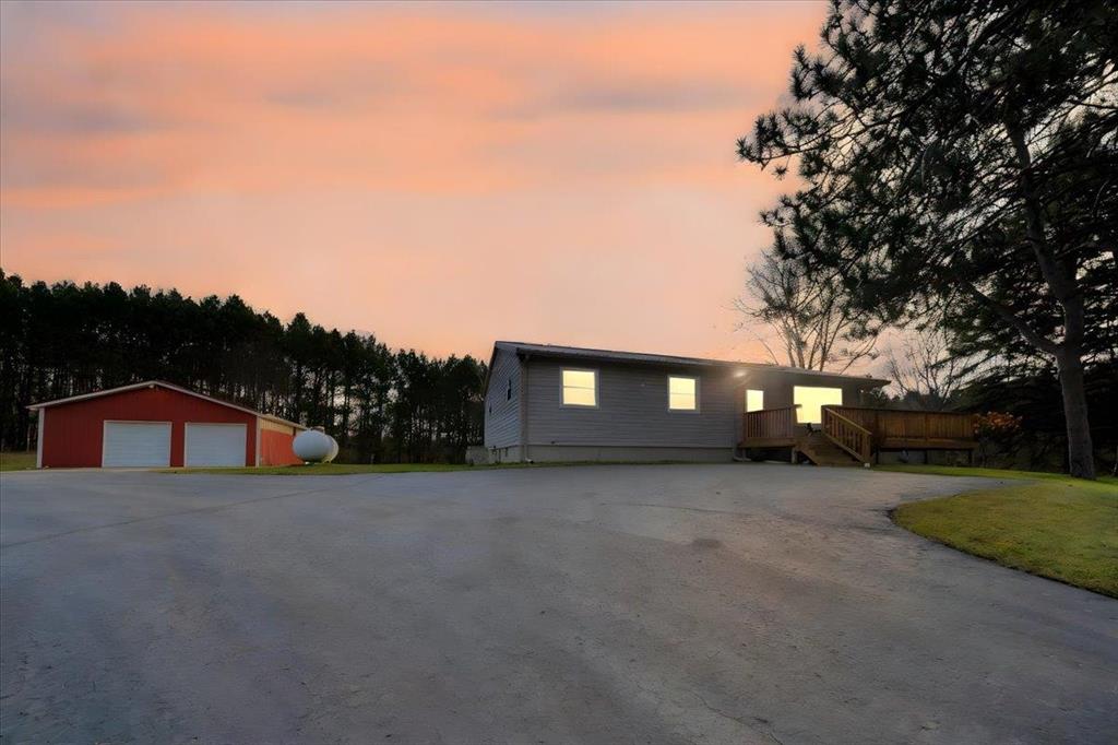 This well-maintained 3-bed, 2-bath home offers comfortable year-round living or ideal recreational use. The home features updated custom oak cabinetry, solid surface countertops, and beautiful real wood flooring through most of the home. The craftsmanship shines throughout with stunning custom oak trim and solid oak 6-panel doors. Newer windows add efficiency and peace of mind. Central Air to keep you cool on those hot summer days! Walk out basement with a new cement patio for grilling or chilling! Spectrum cable internet available for fast streaming, remote work, and smart home use. The home sits tucked back off the road, offering a peaceful and private setting surrounded by mature trees and scenic woods-perfect for those seeking tranquility. A 30x40 pole barn adds tremendous value with a concrete floor, water, and power door openers-ideal for storage, workshop, or great for storing all your toys! An additional 14x20 storage shed with a garage door and opener perfect for the smaller equipment. Located just 5 minutes from West Branch for shopping, dining, medical services and all the amenities of West Branch; close to miles of ATV and snowmobile trails for your recreation and fun! This property provides the perfect blend of convenience and privacy. Turn-key, clean, and ready for your next adventure! NOTE: Deadline for offers is Monday, November 24, 2025 at 6 p.m. All offers will be reviewed on Tuesday. If buyers are walking the property - Please wear hunter orange