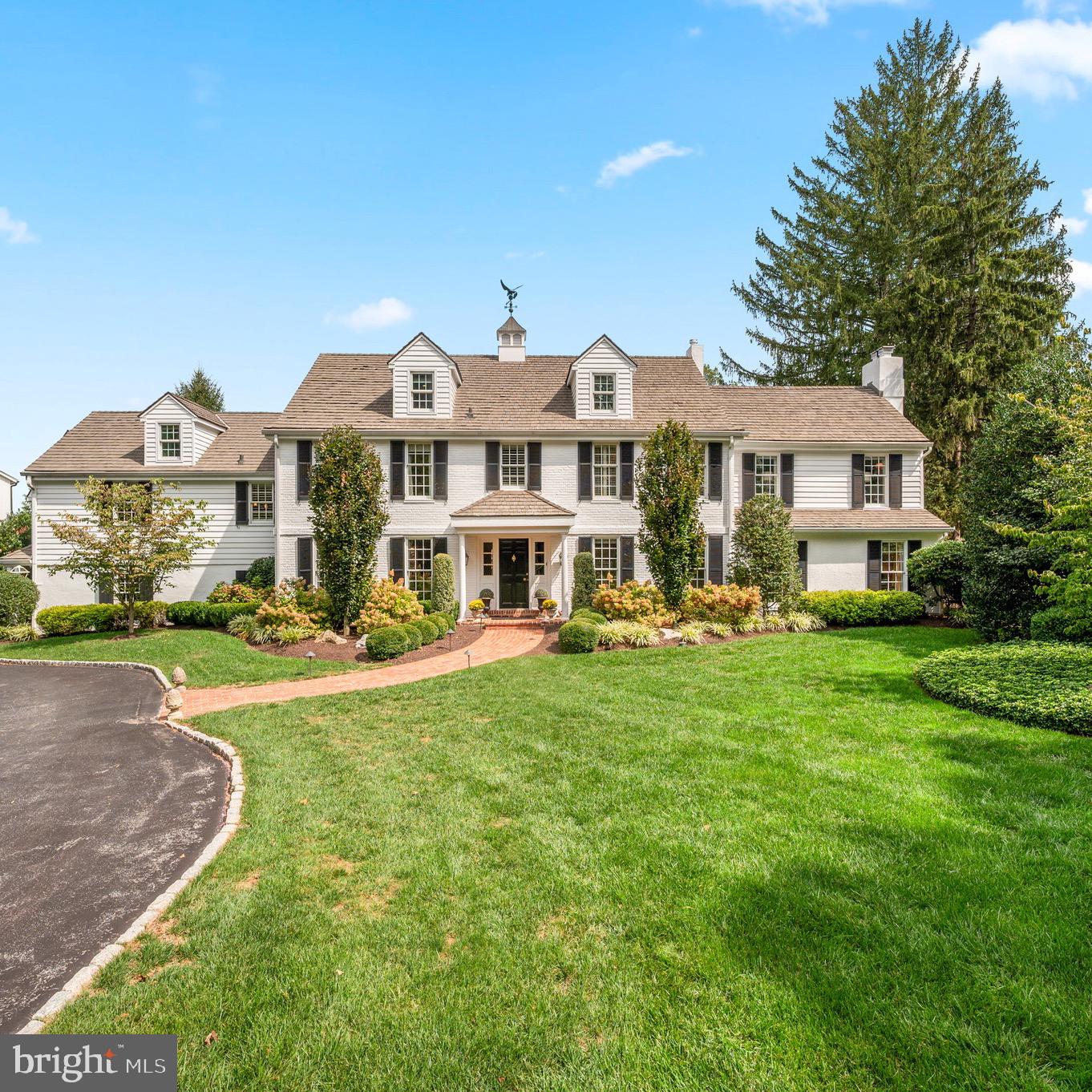 The curb appeal is just the beginning of your love affair with this stunning property! This spectacular three-story expanded Colonial sits on a private, beautifully landscaped 1.4-acre lot on a quiet Northside Villanova cul-de-sac. Warm, yet sophisticated, this "Forever house” is a rare opportunity, set on one of the most desirable lanes in Villanova.Thoughtfully renovated from top to bottom, the home blends timeless elegance with modern luxury, offering space for both grand entertaining and everyday living. From the gourmet chef’s kitchen to a custom pub room, a wine cellar, and lush grounds with pool and spa—every space has been designed with comfort and style in mind.Enter the property through stone pillars on either side of the circular drive. The first floor welcomes you with a gracious foyer featuring charming millwork and hand-pegged wood floors that flow into the fabulous eat-in kitchen, showcasing Halkett custom cabinetry, double-thick marble countertops, custom mosaic backsplash, 6-burner Wolf range with grill, separate Thermador refrigerator and freezer, wet bar with beverage frig, and a unique coffee bar pantry. The adjoining dining room is perfect for large gatherings, while the oversized family room connects to the elegant step-down living room with gas fireplace, crown moldings, French doors, and serene yard views.Just off the kitchen is a mudroom with built-ins and garage access. A breezeway/sunroom leads to the custom pub room, paneled with reclaimed wood from a Chicago speakeasy, complete with electric fireplace, powder room, and French doors to the fire pit area and backyard—an entertainer’s dream. This versatile space could also function as a private office with its own entrance.The finished lower level offers a 1,500-bottle temperature-controlled wine cellar, gym, laundry, and storage.The second floor showcases the luxurious primary suite including a sitting area, gas fireplace, and two walk-in closets with brand-new custom cabinetry. The marble ensuite bath boasts heated floors, imported fixtures, television, custom cabinetry with charging station, and a private WC. Four additional bedrooms and four baths (three ensuite) complete this level, including a full in-law/guest suite featuring a kitchenette, sitting room, laundry, and spacious bedroom with full bath.The third floor provides flexible living space with a great room, office, and an additional full bath. A game room offers abundant cabinet storage and access to a large walk-in attic storage.Outdoor living shines with a large bluestone patio and awning-covered sitting and dining area overlooking the pool, spa with waterfall, and lush landscaping with hydrangeas, mature trees, and plenty of flat yard space for play, pets, or relaxation.Located in the award-winning Lower Merion School District and close to many private schools, universities, country clubs, shopping, dining, and major highways to Philadelphia, New York, and beyond—this exceptional home offers convenience, luxury, and Main Line living at its best. Showings start Thursday the 18th. Schedule your private tour today!