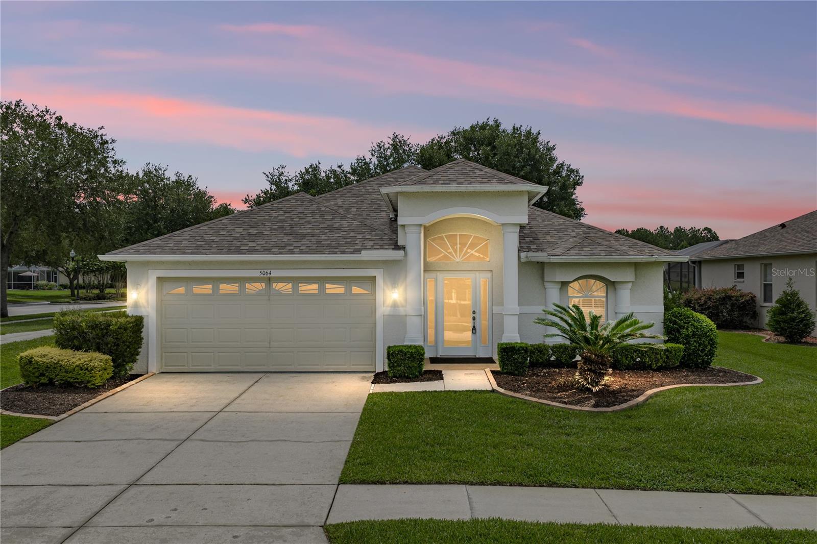 Golf course views, a corner lot setting, and a golf cart path just steps away make this home a natural fit for life inside the gated golfing community of Hernando Oaks! Set along manicured streets with a tree-lined approach, this 3 bedroom, 2 bath, 2 car garage home offers a 2024 roof, 2020 AC, mature landscaping, and a covered entryway that creates a warm first impression. Inside, high ceilings, luxury vinyl plank flooring, and beams of natural light bring an airy, comfortable feel to the flexible floor plan. The formal living and dining room creates a more intimate setting for holidays, dinners, and quiet conversation, while the combined family room and chef’s kitchen sit at the heart of the home for livelier gatherings. Sliding doors extend the space to the screened back porch, where golf course views create a beautiful backdrop for easy alfresco dining. The kitchen is ready for everyday cooking and weekend hosting with a 4 piece appliance package including a gas range, a large center island with seating and storage, pantry storage, two tones of granite for a designer touch, and a built-in desk nook. With open sightlines into the family room and quick access outdoors, the space feels connected, useful, and easy to enjoy. Privately split from the secondary bedrooms, the primary suite includes a spacious bedroom, an oversized walk-in closet, and a unique attached bonus space with vaulted ceilings and sliding doors to the back porch. Whether used as a sitting room, office nook, nursery, or peaceful reading area, it adds a special layer of flexibility to the suite. The ensuite bathroom features dual sinks, a separate soaking tub, and a walk-in shower. Across the home, bedrooms 2 and 3 sit near the second full bathroom with dual sinks and a tub/shower combination. A laundry room with a sink and cabinet storage leads into the 2 car garage, adding extra function to the layout. Step outside onto the screened porch overlooking the golf course, offering a quiet place to relax, dine, and take in the view. Hernando Oaks residents enjoy a social membership to the Hernando Oaks Golf Club, with discounted golf rates, access to the restaurant and events, and two newer pickleball courts to enjoy. Give us a call today to learn more about this lovely home in an excellent Brooksville golfing community!