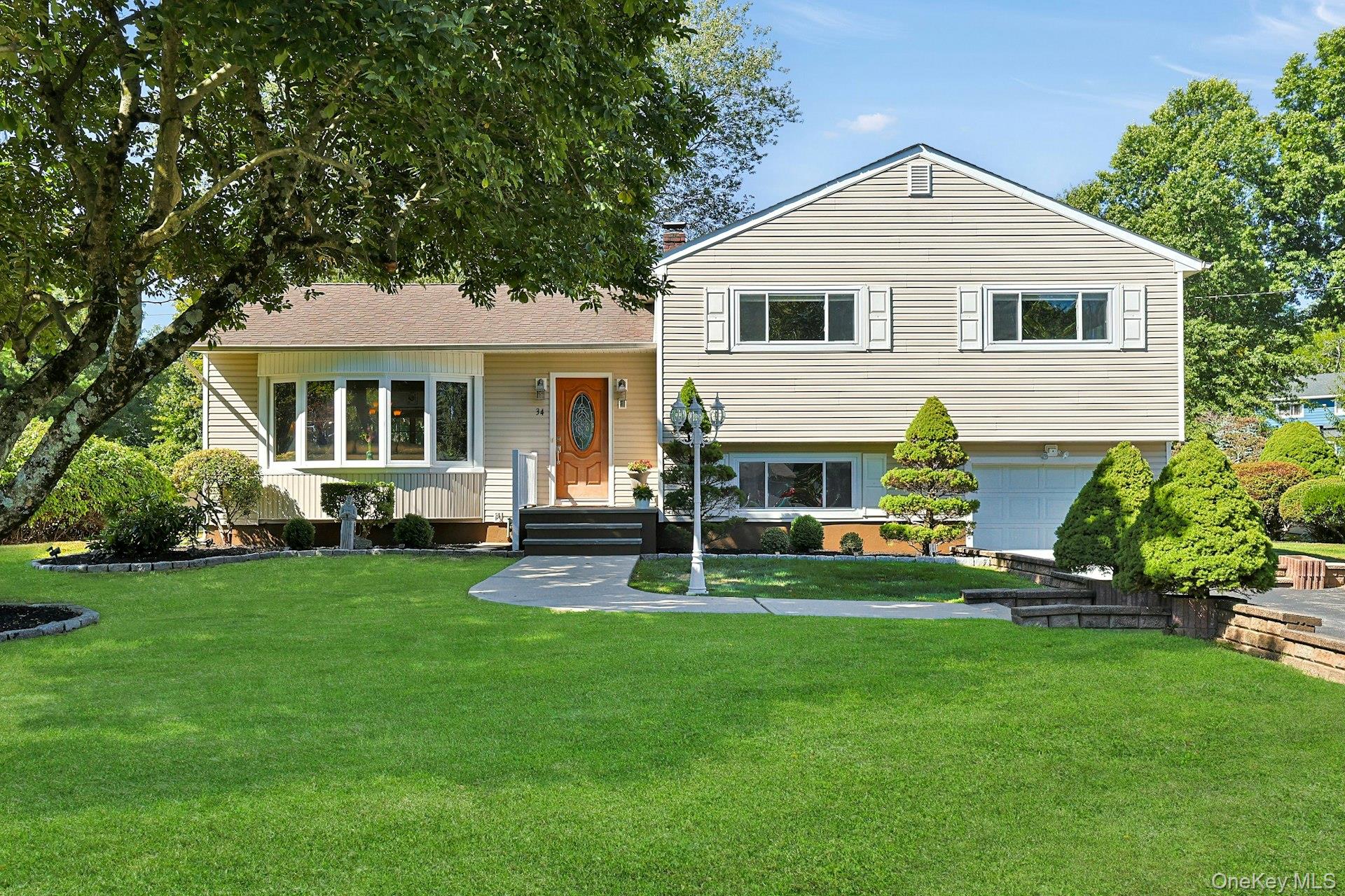 Welcome to 34 Ganung Drive. A charming property located in the Torbank Bank neighborhood on one of the most sought-after streets in the Town of Ossining. This beautifully appointed 3-bedroom, 2-bath home offers ample space for relaxation and entertainment with exceptional convenience for today’s lifestyle. Inside, the kitchen is a chef’s delight, featuring custom cabinetry and granite countertops that make meal preparation a pleasure. The layout includes a sun-filled living room and dining area, ideal for gatherings. The primary suite features an en-suite bath, while two additional bedrooms share a hall bath. Downstairs, a versatile space awaits —whether you need a home office, family room, or guest suite, this area adapts to your lifestyle needs and includes access to the garage. Outside, the meticulously landscaped backyard sprawls over a generous half-acre. Here, you’ll find a deck, an above-ground heated pool, and private outdoor space perfect for lounging and entertaining amidst lush greenery. You will love the prime location: just two blocks from Route 9A and 45 minutes to Grand Central via Ossining or Croton-Harmon Metro-North stations. Lovers of the outdoors can enjoy being minutes from Teatown Lake Reservation, riverfront trails, parks, and recreation. Convenient to vibrant restaurants, shops, and all the charm that Ossining and the River towns have to offer.
