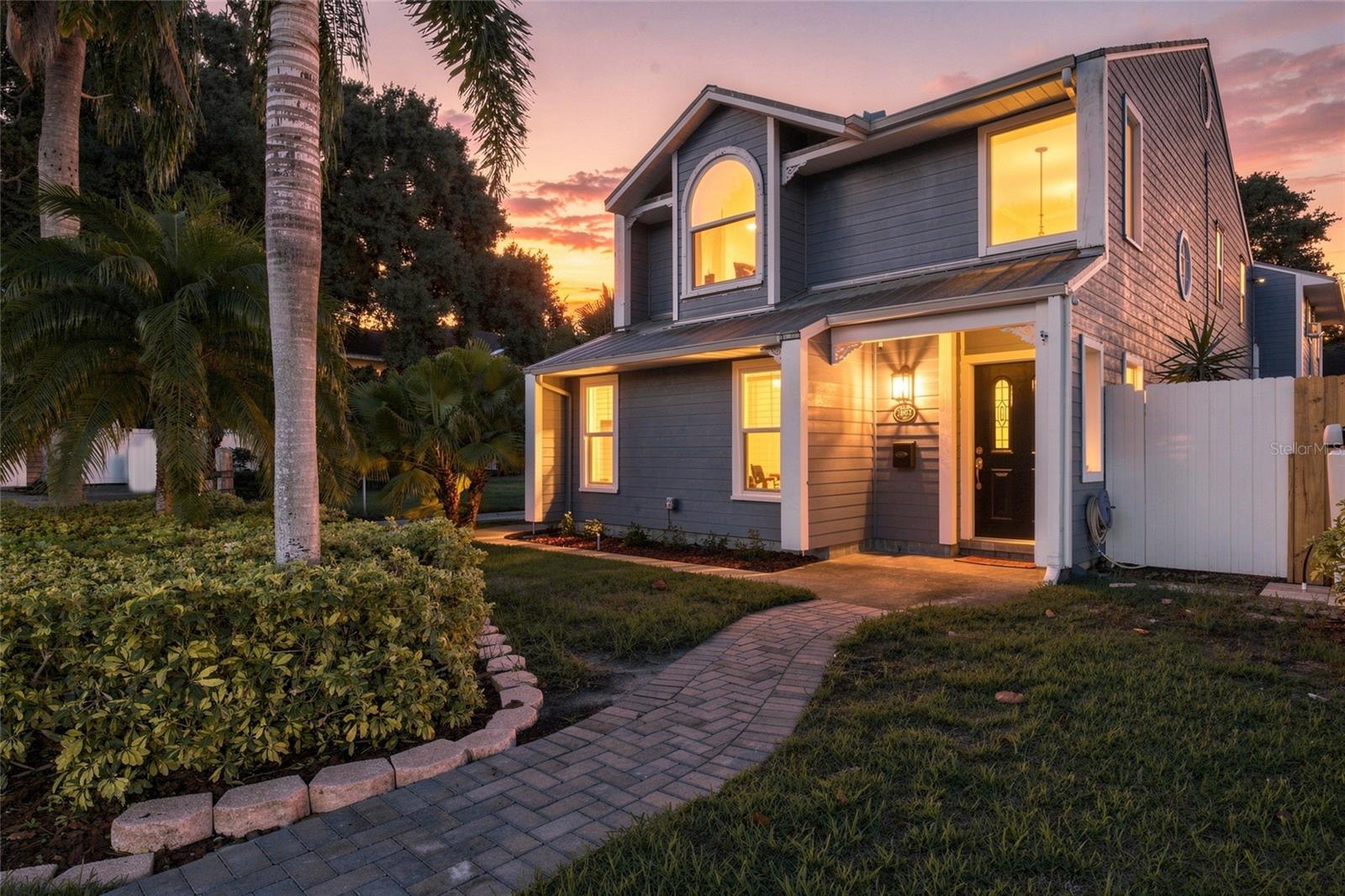 Virtually Staged. In the heart of Palma Ceia on a corner lot with brick streets you will be at home with an amazing location providing flexibility, and low-maintenance living in South Tampa.  The main house offers 2 bedrooms and 2.5 baths across a smart, easy-to-love layout complete with a Sonos speaker system.  The kitchen is equipped with a gas stove ready for the home cook. The water heater, washer and dryer are also gas appliances. A screened area between the house and garage adds outdoor living without the upkeep of a big yard which is perfect for morning coffee or evening wind-down. Above the detached 2-car garage sits a private 312-square-foot ADU with its own bedroom and bath, ideal as a guest suite, home office, or income-producing rental. Durable metal roof for long-term peace of mind. Total living space spans just over 2000 square feet across both structures. All of this sits walkable to Bayshore Boulevard, Hyde Park Village, Palma Ceia County Club and everything that makes South Tampa one of the city's most sought-after pockets. Whether you're buying up, scaling down, or need flexible space for family or guests, this corner-lot gem delivers. Hurricane windows were installed in 2019.  Sprinkler system was replaced in 2024, new hot water heater in 2024 and there is a transferrable termite warranty with this home.