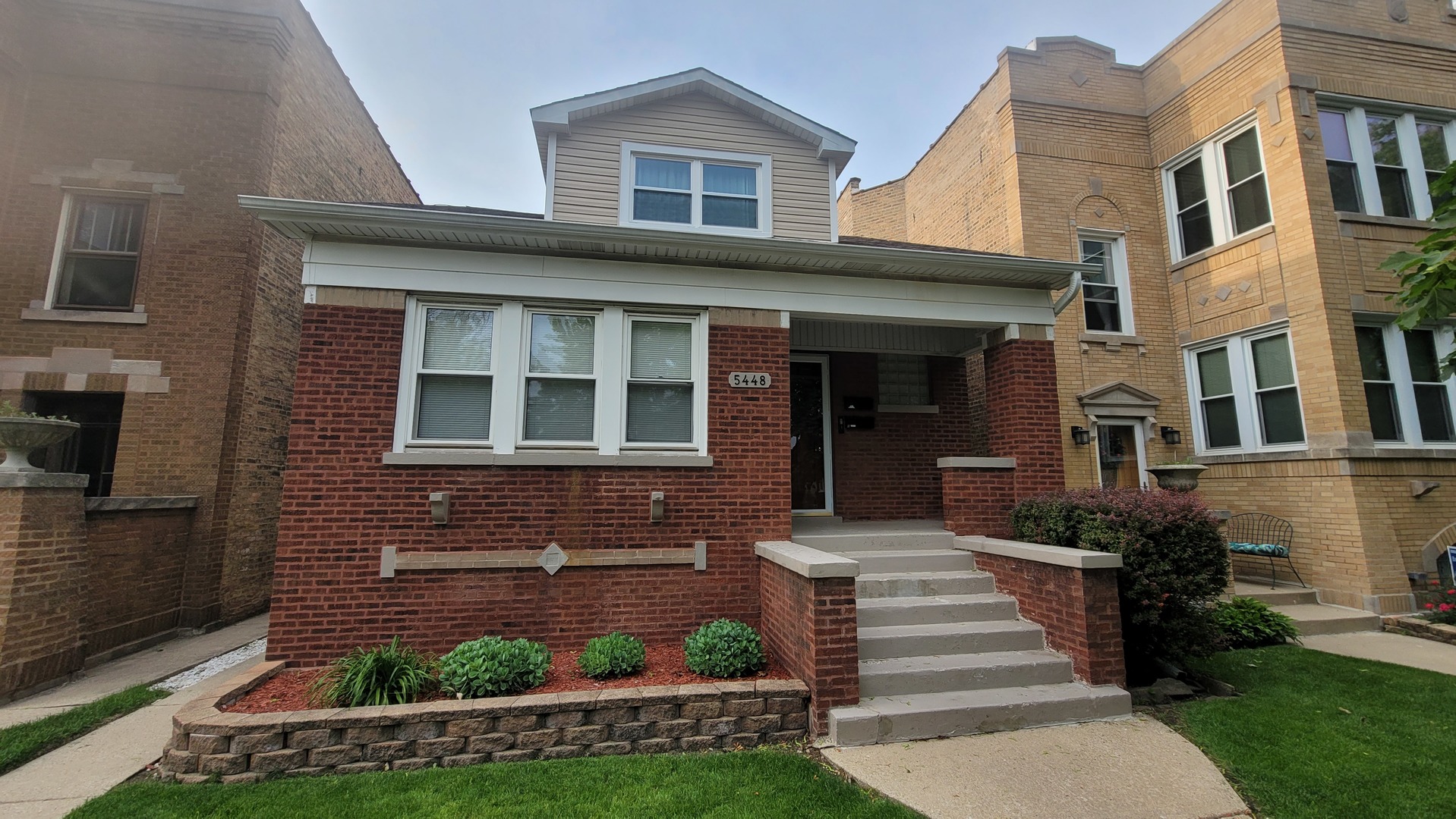 Location, location, location! Beautiful, move-in ready, solid brick Bungalow on an oversized lot in hot Jefferson Park. An investors dream. This property has been greatly cared for and maintained. Tuckpointed walls, updated windows, appealing landscaping greet you as you walk up to the building. Wonderful South facing porch as you enter to foyer guiding you to two spacious units.  Starting upstairs we have a large living area, spacious and sunlit bedroom, and updated kitchen. Plenty of storage throughout. Classy vinyl flooring and fully stocked kitchen. Leading to main level we have another remodeled kitchen with brand new quartz countertops, with SS sink and appliances. Freshly painted rooms. Pristine wood floors throughout. Three very large bedrooms each with lots of storage space and a stunning full bathroom. Updated lighting and electric. The upper level is perfect for an in-law arrangement. Each unit has separate heating and electric meter.  Full finished basement provides endless possibilities, boasts 2 entrances, tall ceiling height, a wet bar, fully updated bathroom with shower, and an additional room that can be used as an office, craft room, or extra bedroom! The second exit leads to the back yard and very well maintained 2.5 car garage. This building is a pleasure to show!
