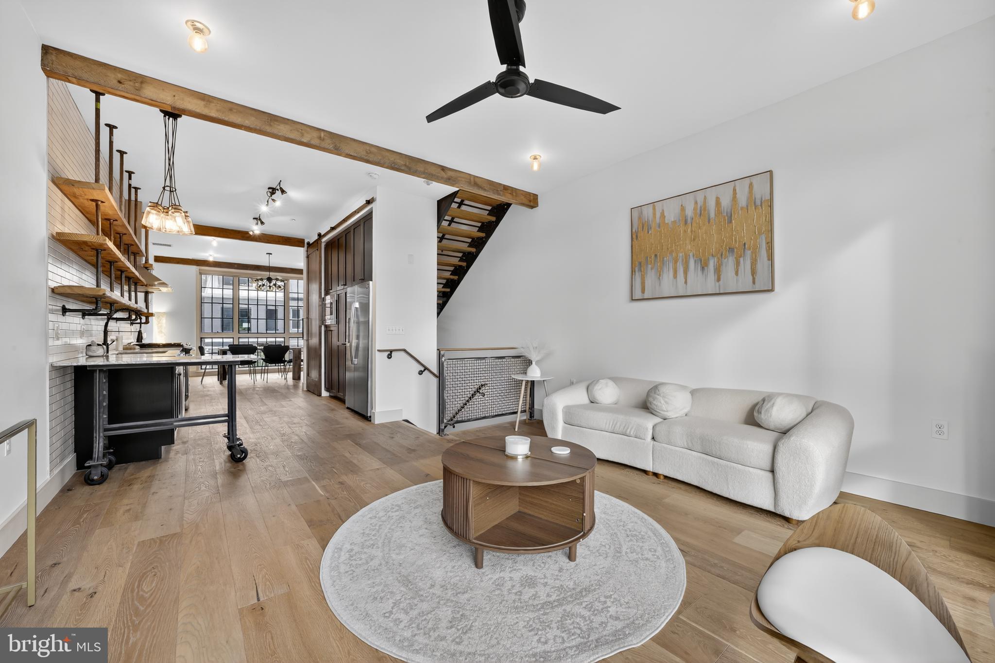 Experience luxury urban living in this stunning modern condo featuring 2 spacious bedrooms, 2 full bathrooms, and a versatile den—perfect as a home office, guest room, or reading nook.\ The open-concept living area is bright and inviting, enhanced by large windows that fill the space with natural light and offer breathtaking city views. The state-of-the-art kitchen boasts premium stainless steel appliances, a top-of-the-line gas range, sleek granite countertops, and stylish open cabinetry—ideal for both everyday living and entertaining. Both bedrooms are designed for comfort, with generous space, large closets, and plenty of natural light. The bathrooms feature contemporary fixtures, elegant vanities, and a combination of walk-in showers and bathtubs for ultimate convenience. The private rooftop deck is the showpiece of this residence, offering panoramic views of the Washington, D.C. skyline—a perfect spot for entertaining, relaxing at sunset, or stargazing under the city lights. Additional highlights include hardwood flooring throughout, modern lighting, central heating and air conditioning, ample in-unit storage, and secure building access with parking. This condo perfectly blends comfort, style, and sophistication—offering a luxurious retreat in the vibrant heart of Washington, D.C.