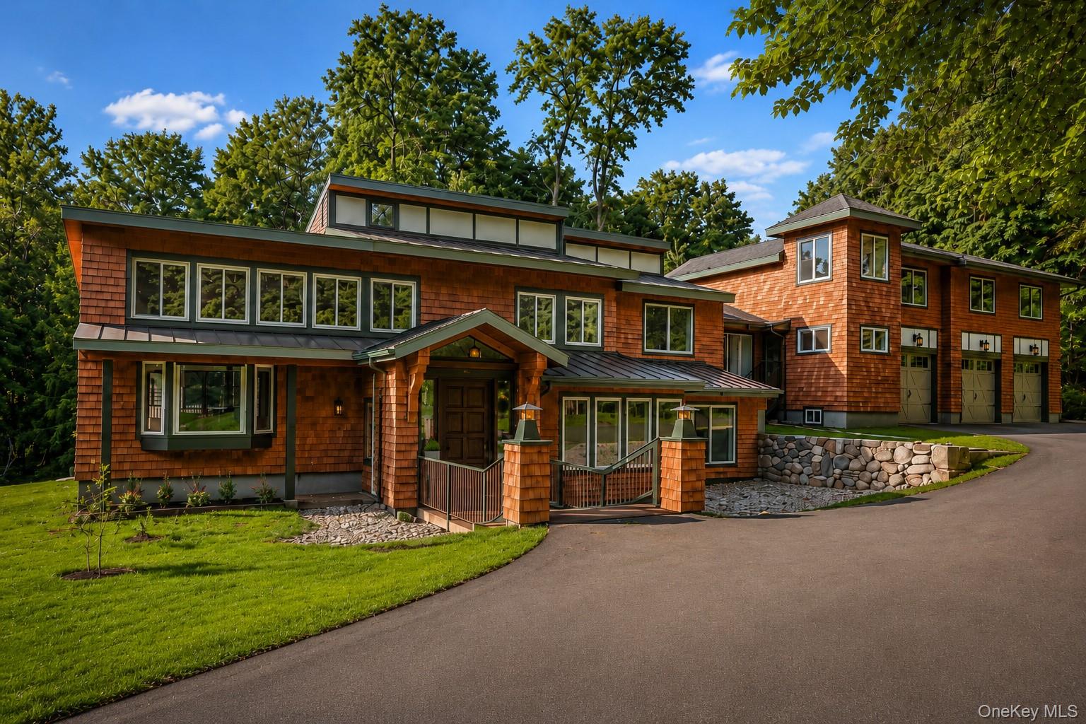 Architecturally distinctive and beautifully integrated into its natural surroundings, this custom cedar contemporary offers a refreshing alternative to the traditional colonial. Set on 4.42 private acres in the heart of South Salem, the home combines dramatic volume, abundant natural light, and exceptional privacy with the comfort and functionality today's buyers desire.Designed for effortless everyday living and memorable entertaining, the home's flowing floor plan features expansive gathering spaces, multiple fireplaces, and a seamless connection to the surrounding landscape. Expansive walls of glass and oversized windows flood the interior with natural light while framing peaceful woodland views throughout every season.Privately tucked away, the spacious primary suite serves as a true retreat, complete with vaulted ceilings, a fireplace, an oversized walk-in closet, and a spa-inspired bath.A beautifully integrated private guest wing offers exceptional flexibility for multigenerational living, extended family, long-term guests, or a sophisticated home office. Complete with its own private entrance, living room, kitchen, two bedrooms, and a full bath, this thoughtfully designed space also presents an outstanding opportunity for supplemental rental income.Outside, expansive decks and patios overlook rolling lawns and mature woodland, creating an idyllic setting for entertaining, quiet mornings with coffee, or simply enjoying the peaceful beauty of the surrounding landscape.Additional highlights include a three-car attached garage, abundant storage, and numerous recent improvements, including a new roof, a beautifully refinished cedar exterior, new garage doors, and meticulous maintenance that reflects true pride of ownership.Located within the award-winning Katonah-Lewisboro School District, this remarkable country retreat offers the perfect balance of privacy and convenience, just minutes from Metro-North, Ward Pound Ridge Reservation, local hamlets, fine dining, and approximately one hour from Manhattan.