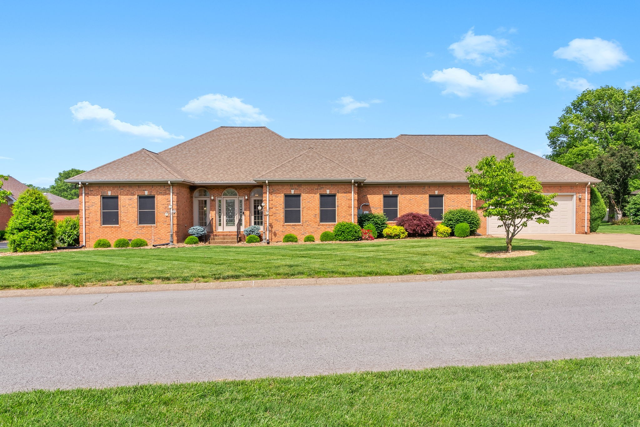 Step into luxury with this remodeled 4 bed, 3.5 bath all-brick home that has it all! From the moment you walk in, you’ll love the open split floor plan with two spacious living areas, stunning tray ceiling, built-in shelf, cozy fireplace, and stylish LVP flooring throughout. The custom kitchen is a showstopper with quartz countertops, custom cabinetry, and a walk-in pantry. The primary suite is your personal retreat with a spa-like bath featuring double vanities, a soaking tub, separate tile shower, and a dream closet with custom shelving. You'll love the large utility/mud room loaded with storage, plus top-notch extras like plantation shutters, a tankless water heater, and a whole-house generator for peace of mind. Step outside and enjoy your private backyard oasis—complete with a covered back patio, in-ground pool with diving board, built-in Weber grill, beautiful landscaping, and a fenced-in yard. Plus, a storage building provides the perfect spot for tools, equipment or pool toys!