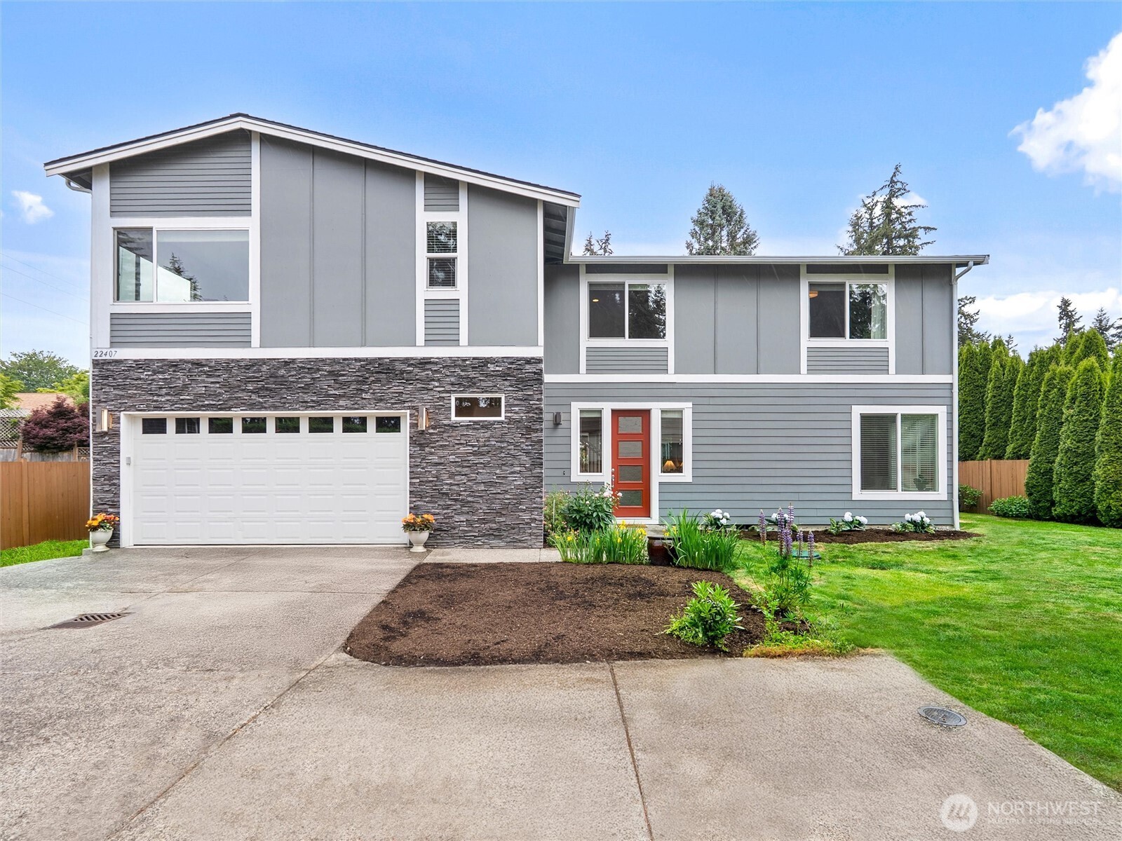 Beautifully maintained residence in the sought-after Westgate area, offering an exceptional blend of style & comfort. This spacious home is thoughtfully designed with elevated finishes & everyday functionality in mind. Soaring main-level ceilings, engineered hardwood floors, slab quartz counters, & a gas fireplace create a warm, inviting atmosphere. The open-concept main level is wired for surround sound with built-in speakers & LeGrand smart lighting. The dining room seamlessly connects to the kitchen featuring a generous island, stainless steel appliances, oversized pantry, & convenient mudroom. A highly desirable main-floor bedroom & ¾ bath offers flexibility for guests, multi-gen living, or a private home office. Upstairs, the spacious primary suite provides a true retreat with generous proportions, walk-in closet, & luxurious 5-piece bath. A large bonus room filled with natural light offers possibilities for media, fitness, play, or work. Enjoy year-round comfort with A/C, gas furnace, tankless water heater, & generator wiring for added peace of mind. Outside, the level south-facing yard is an entertainer’s dream, perfect for soaking up the sunshine & enjoying mature peonies, hydrangeas, tulips, & blossoming cherry trees. Additional highlights include ample parking & tons of  storage closets. This 10-Years young turnkey Edmonds gem delivers convenience, ideally located near top amenities, schools, parks, beaches, & commuter routes. MUST SEE!