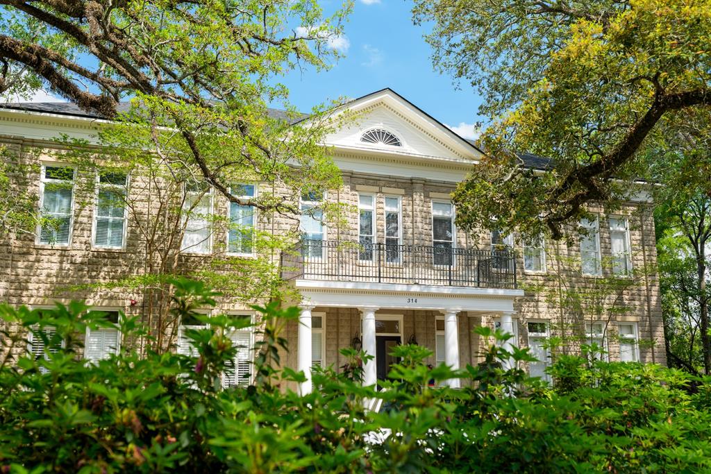 Welcome to the historic Rosemary Condo—one of downtown Thomasville's most charming and exclusive residences. Ideally located just two blocks from “the bricks,” you'll enjoy easy access to some of the area's best dining, entertainment, and local hotspots, all while tucked away in a peaceful, private setting in the highly desirable Dawson Street Historic District.  This landmark structure has been completely renovated and thoughtfully converted into eight luxury condominiums, blending timeless character with modern convenience. The property showcases stunning architectural details including antique heart pine flooring, soaring ceilings, custom millwork, and elegant moldings—all set among beautiful live oaks and meticulously manicured grounds.  Unit 204 is a beautifully appointed upstairs residence offering 1,292 square feet of thoughtfully designed living space. This 2-bedroom, 2.5-bath unit is located on the rear side of the building, providing a quiet retreat with serene views overlooking the community's inviting courtyard. Residents enjoy gathering in this shared outdoor space, complete with a firepit and grilling area—perfect for relaxing evenings or casual entertaining. An elevator provides easy access to the second floor, adding convenience to this charming historic setting.  The Rosemary Condo is comprised of only eight units, all owner-occupied, ensuring a close-knit community and preserving the quiet integrity and exclusivity of the property. With no rentals allowed, residents enjoy a peaceful, residential atmosphere with fabulous neighbors and beautifully maintained common areas.  Whether you're seeking a full-time residence or a charming downtown getaway, Unit 204 offers timeless character, modern comfort, and an unbeatable location in the heart of Thomasville. This is a rare opportunity to own a piece of history—don't miss it!