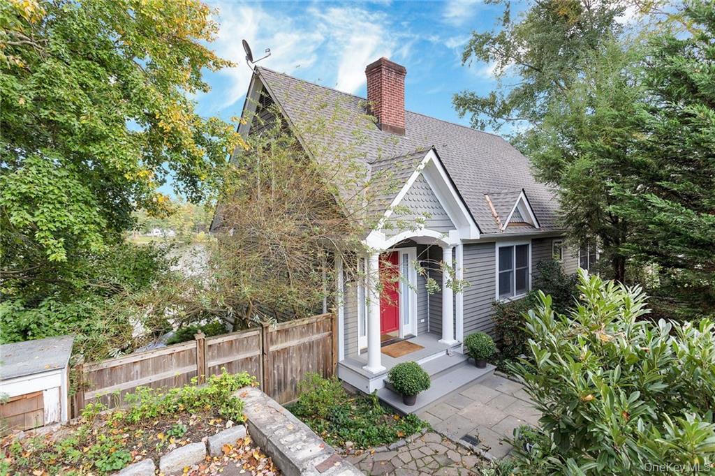 Lakefront Lakehouse Retreat – 52 Miles to Midtown NYCExperience the perfect blend of tranquility and convenience in this stunning lakehouse just 52 miles to Midtown Manhattan—an exceptional opportunity for a full-time residence or weekend escape close to NYC.Set on nearly a half-acre with approximately 140 feet of private lake frontage on beautiful Truesdale Lake, this charming lakefront home offers spectacular water views from nearly every room. Terraced gardens with mature plantings and specimen trees lead to sweeping lawns, a generous flagstone patio, and your private dock—perfect for boating, paddleboarding, kayaking, fishing, swimming, and winter ice skating.Designed for both everyday living and effortless entertaining, the chef’s kitchen features soapstone countertops, a propane cooktop, center island with seating, large pantry, and French doors that open seamlessly to the patio. The family living room is anchored by a striking fireplace and framed by expansive lake views, with a dedicated yet open office space nearby.The lower level includes a full bath with radiant heated floors for added comfort.A welcoming covered porch leads into the foyer, immediately drawing your eye to a wall of windows overlooking the lake. The cozy primary bedroom is complemented by an adjacent room offering generous closet and storage space, while the full bath nearby functions comfortably as an en suite. An additional flexible room on this level is ideal for a home office, nursery, or music room.Upstairs, two additional bedrooms and a full bath showcase incomparable panoramic views of the lake.Just a short stroll away, residents enjoy access to a private sandy beach. This exceptional lakehouse near NYC delivers year-round recreation at your doorstep while remaining convenient to local shops, dining, Metro-North trains, and an easy commute to Manhattan.A special opportunity to own a lakefront home close to NYC—where everyday living feels like a vacation.