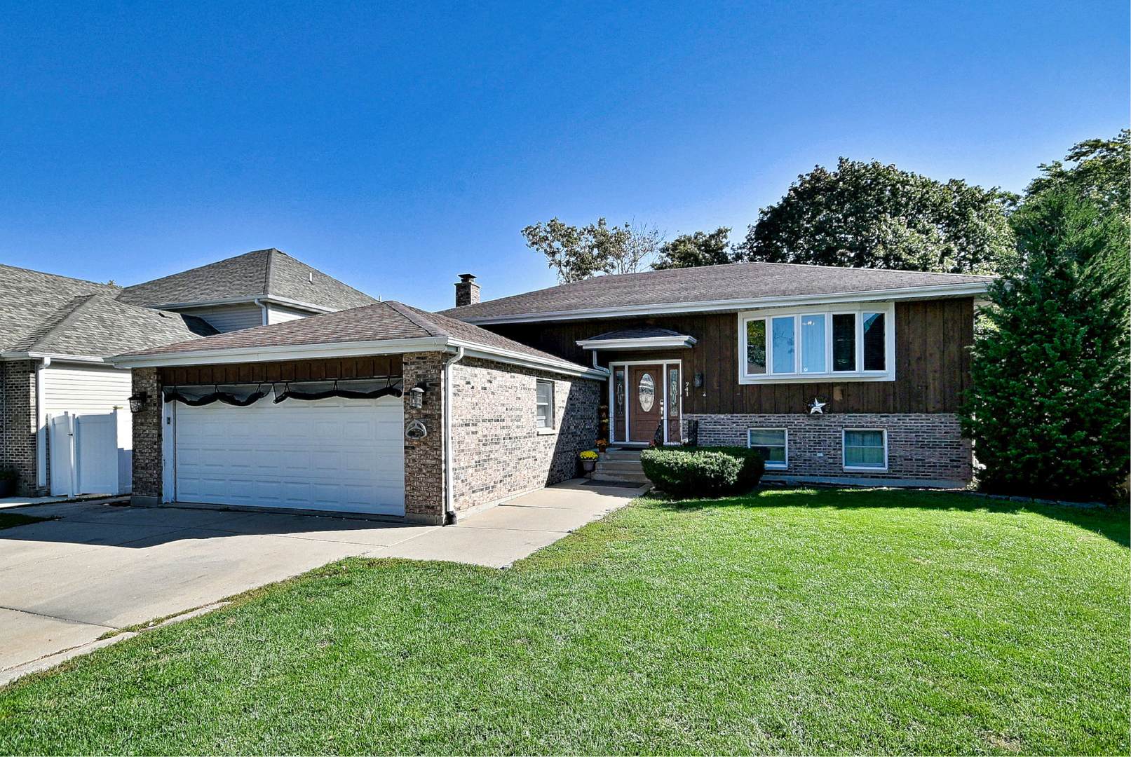 Opportunity Awaits! This spacious 4-bedroom, 3-bath Raised Ranch offers over 2,500 square feet of living space and a versatile floor plan.  As you enter the home, you'll immediately appreciate the large living room and exceptionally spacious kitchen featuring abundant cabinetry, island, and plenty of room for a large dining table. Sliding glass doors lead to a lovely deck overlooking the private backyard-perfect for relaxing or outdoor entertaining.  The main level features a primary bedroom with private ensuite bath, a second bedroom, and an additional full bath.The lower level offers two additional bedrooms, a full bath, and a warm and inviting family room highlighted by a wood-burning fireplace with gas start. A convenient second small kitchen area adds extra functionality and versatility to the space. Radiant heated floors throughout the entire lower level provide added comfort during the colder months. A separate laundry/mechanical room offers convenient direct access to the backyard.  The attached 2.5-car garage also features heated floors, making it a comfortable and functional space year-round. Situated on a generous 60 x 132 lot and conveniently located near shopping and expressways, this home offers plenty of space, comfort, and potential to make it your own.