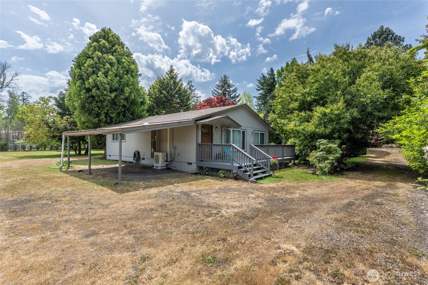 Tucked along a quiet inlet off the COLUMBIA RIVER, this Puget Island waterfront retreat offers the kind of peace people search for but rarely find. Set on 0.7 acres with mature fruit trees, shaded gathering spaces, rare palm trees, and 165ft of waterfront, this property invites you to slow down and enjoy island life at its best.    Spend mornings kayaking from your private dock, afternoons fishing or boating on the river, and evenings watching sunsets from the expansive deck while eagles soar overhead. The sound of the water, the river breeze, and the privacy of the setting create a truly calming atmosphere.    Inside, the comfortable 2-bedroom home offers a spacious, easy-flow layout with river and garden views throughout. The newly repaired 90ft dock provides deep water moorage and easy access to the water. Peaceful and tucked away, yet just 5 minutes to the Oregon ferry, 45 mins to Astoria, and 90 mins to PDX