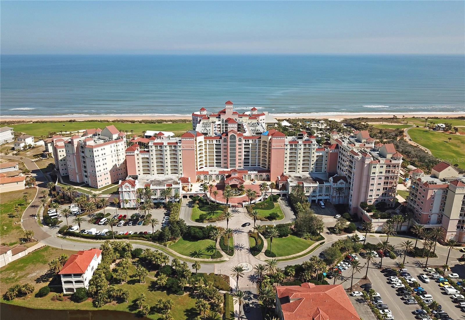 Prepare to be captivated by this stunning coastal retreat in the coveted North Tower of Hammock Beach Resort. This expansive 3-bedroom, 3.5-bath residence represents the pinnacle of seaside elegance, boasting the largest floor plan available in the Ocean Towers. Step off your private elevator into a bright, open layout featuring soaring ceilings and timeless travertine flooring. Recently renovated, the home showcases high-end finishes and designer furnishings throughout, creating a refined yet welcoming ambiance. The thoughtfully designed guest wing is tucked just off the foyer, offering two spacious bedrooms, each with its own ensuite bath and walk-in closet. Great for hosting family and friends in comfort and privacy. At the heart of the home, the chef’s kitchen is a true showpiece, outfitted with new cabinetry, sleek quartz countertops, and state-of-the-art GE Café appliances. Whether you're preparing a quiet dinner or entertaining a crowd, this space delivers both style and functionality. The dining and living areas flow seamlessly onto an oversized balcony, where lush landscaping, resort vistas, and the shimmering Atlantic Ocean provide a breathtaking backdrop for everyday living. If you are looking for an investment property, this condo currently gets the highest nightly rate for a resort view. A Hammock Beach Membership can be purchased so you can enjoy 5-star amenities and private beach access. With two 18-hole Championship golf courses, nine pools including a lazy river, waterslides, eight Har-Tru tennis courts, pickleball courts, multiple dining venues, a world class spa, nine-hole mini golf course, volleyball court and a state-of-the-art exercise facility, you will always be enjoying Hammock Life!