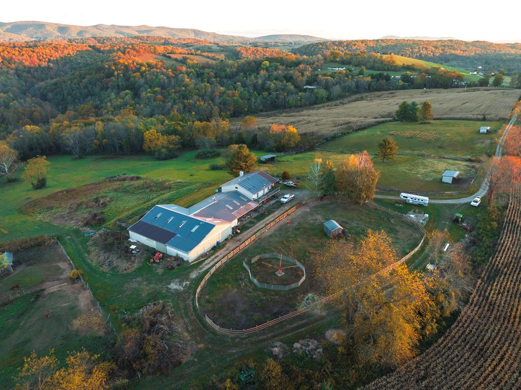 This 87-acre working horse farm with a 3-bedroom, 7-stall barndomenium. Land offers rolling hay and pasture fields with 20 acres of crop.  New, board fence round pen. Farm fenced and crossed fenced with run in sheds for the horses. Large indoor arena with 3 stalls, office and bath, tack room, wash stall, 48x36 lounging area, a 36x50 garage shop area for your equipment, and hay storage.    Take a moment to enjoy your 3000 sq ft of wrap decking to take in your mountain and pasture views.  Home is private yet only 15 minutes to the interstate.   All of this, and it joins Cripple Creek!