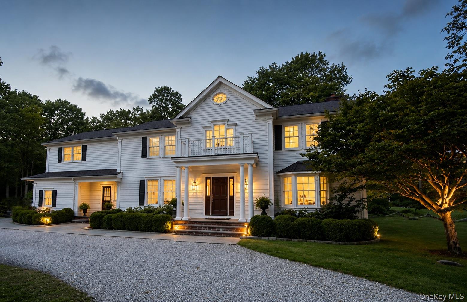 Perfectly sited at the end of a quiet cul-de-sac, this Pound Ridge residence combines timeless charm with modern comfort on two beautifully landscaped acres. Surrounded by specimen plantings, gardens, and mature trees, the property offers exceptional privacy, a large level yard, a stone-lined koi pond, and a stunning slate patio with a fire pit - an ideal setting for entertaining or simply enjoying the outdoors. Inside, the home is rich with detail, featuring wide-board floors, custom moldings, and built-ins throughout. The heart of the home is the gorgeous kitchen, designed with marble countertops, a beadboard ceiling, brass pendant lighting, and a large center island that invites gathering. A commercial-grade range, separate full-size Sub-Zero refrigerator and freezer, and farmhouse sink make the space both beautiful and functional. The kitchen opens seamlessly to the family room, where exposed beams and a stone fireplace create a warm and inviting atmosphere. Additional features include new composite siding, a new roof, many new windows, central air, and a whole-house generator. The finished lower level (not included in the listed square footage) adds flexible living space, while the circular drive enhances curb appeal. With a potential pool site and peaceful setting just minutes from town, this property offers the best of country living-only about an hour from New York City.