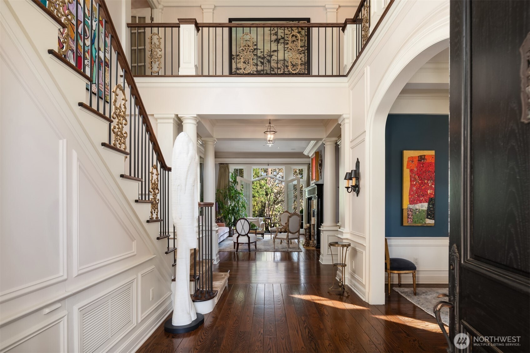 A grand arrival unfolds timeless architecture, refined interiors, and walls of windows.