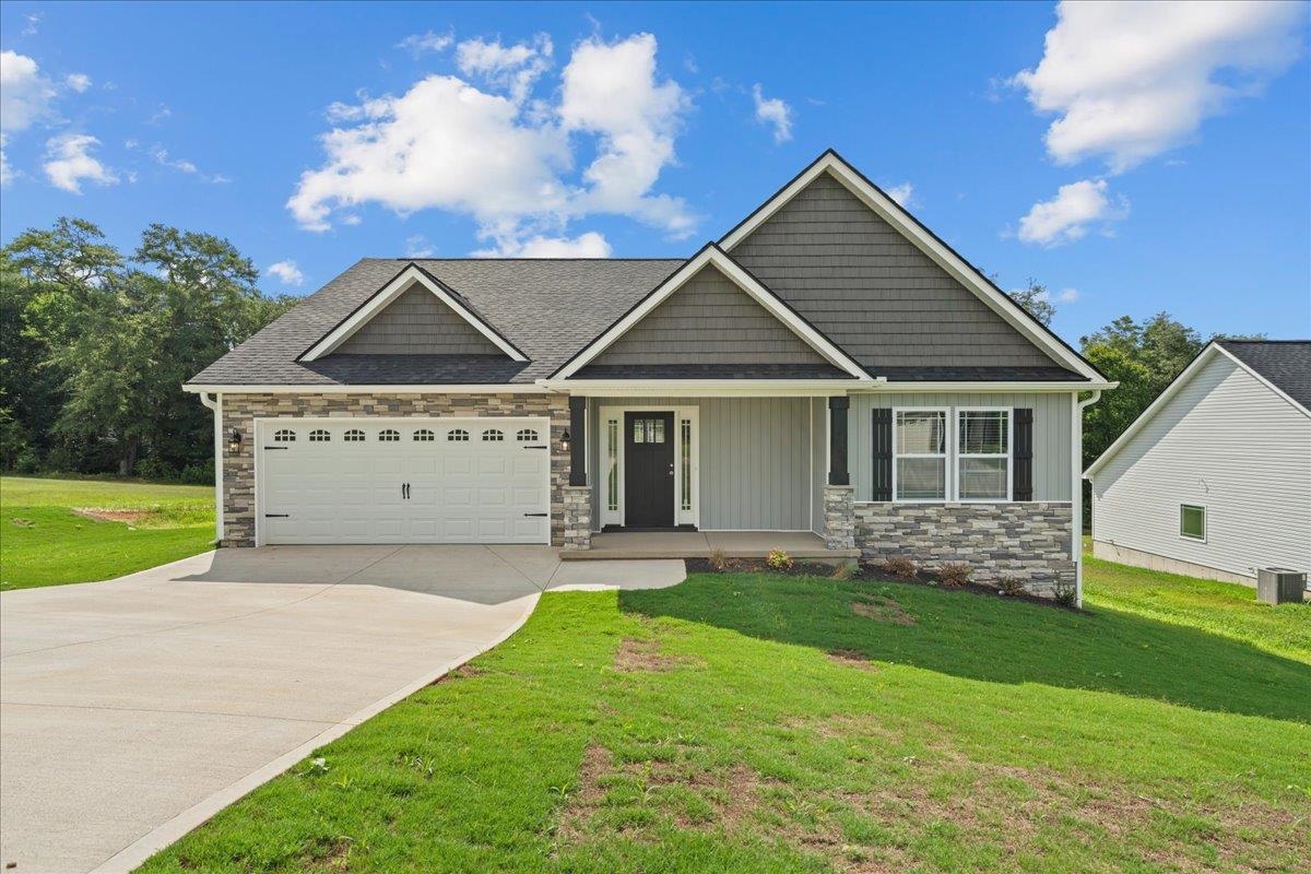 Welcome to the Franklin floor plan. This spacious 3 bedroom, 2 bathroom home sports several upgrades including a sunroom, half stone fireplace, luxury vinyl plank flooring, craftsman siding package, and more! Situated on a .43 acre lot in the new Fall Creek community in Inman. Call today for more info!
