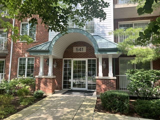 Beautiful, bright, top floor corner/end unit full of light and lovely views!  2 bedroom, 2 bath unit with laundry room/washer/dryer/sink!  Soon the views will include a new park and creek/river!  New dishwasher, hot water heater, carpeting in bedrooms, primary walk-in shower!  Investor friendly building!  Open floor plan and spacious living room/dining room combo with loads of natural light.  Good sized kitchen stainless steel appliances with eating area.  Lovely patio door leads out to an ample sized balcony for your outdoor enjoyment/coffee/grilling.  Elevator building, one heated/covered garage parking space included and a storage space as well.  Short jaunt to Metra train, stores, schools and all that Barrington has to offer such as concerts/parades/farmers market/etc.  This is a terrific opportunity for a lucky buyer!