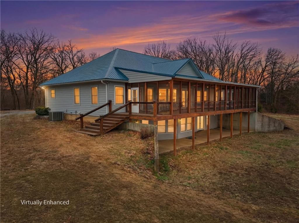 A true Triple Feature property including an amazing home, 222+/- acres of land and a guest house.  Tucked away just outside Osceola, MO, this exceptional listing offers the rare combination of luxury living and privacy all on an expansive property.  Situated on just over 222 acres, the land features a beautiful mix of mature woods, timber, ponds, open pasture and ample wildlife, including an abundance of deer and turkey. The main residence has an impressive nearly 6,000 sq ft of living space. Built in 2009 and designed for both comfort and function, this home offers 3 bedrooms and 3.5 bathrooms, including a main level master-suite with double walk-in closets. The gorgeous kitchen stands out, featuring high-end finishes and a huge walk-in pantry. Enjoy the views on the amazing screened-in porch and the expansive covered patio overlooking your piece of heaven.Additional features include a massive 3-car garage for your cars, side-by-sides and outdoor toys.  And its temperature controlled too!   For hunters or security needs the basement includes a secure 400 + sq ft safe room with a Smith Security Safes Inc’s vault door.  A Generac whole-home generator, for peace of mind, is another perk.A fully functional guest house adds tremendous value, featuring its own kitchen, living room, bedroom loft and garage—perfect for guests, extended family, or rental potential.The Property has road frontage on three sides; access is excellent while still maintaining a secluded feel with the main residence sitting one half a mile off the highway.  The timber offers unlimited opportunity for hunting and recreation.  Mixed in is over 30 acres of easily accessible pastureland and/or hay fields, further enhancing this properties potential.