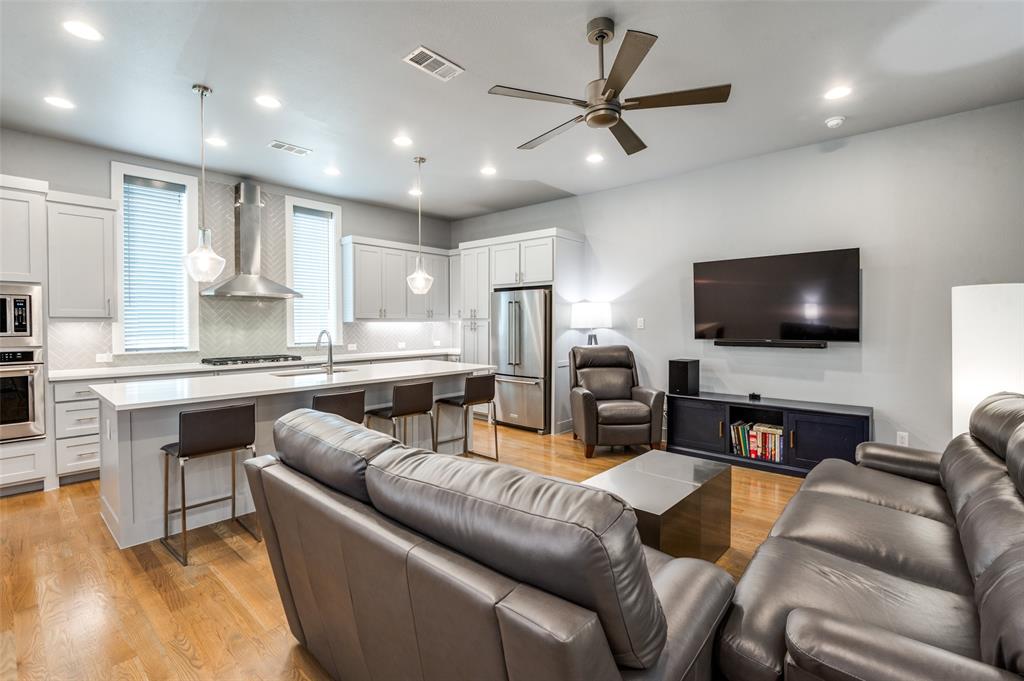 Modern Design Meets Urban Living in the Heart of Dallas! Welcome to 4776 Asher Place—an impeccably designed 2-bedroom, 2.5-bath contemporary townhome located in the gated Urban Place community just minutes from Lower Greenville, Deep Ellum, Uptown, and Downtown. This stylish 3-story home features clean architectural lines, high ceilings, and an open-concept layout ideal for entertaining.

The main living floor is filled with natural light and showcases hardwood floors, a sleek kitchen with quartz countertops, stainless steel appliances, and a large island with bar seating. Both bedrooms offer ensuite baths and modern finishes, while the spacious primary suite includes a spa-inspired bathroom and oversized shower.

Enjoy stunning Dallas views from your private rooftop deck—perfect for lounging or entertaining under the stars. Additional highlights include a tankless water heater, energy-efficient foam insulation, smart home wiring, and an attached two-car garage. HOA covers exterior maintenance, giving you low-maintenance, lock-and-leave convenience.

Don’t miss this opportunity to own a well-maintained home in one of Dallas’ most dynamic neighborhoods!