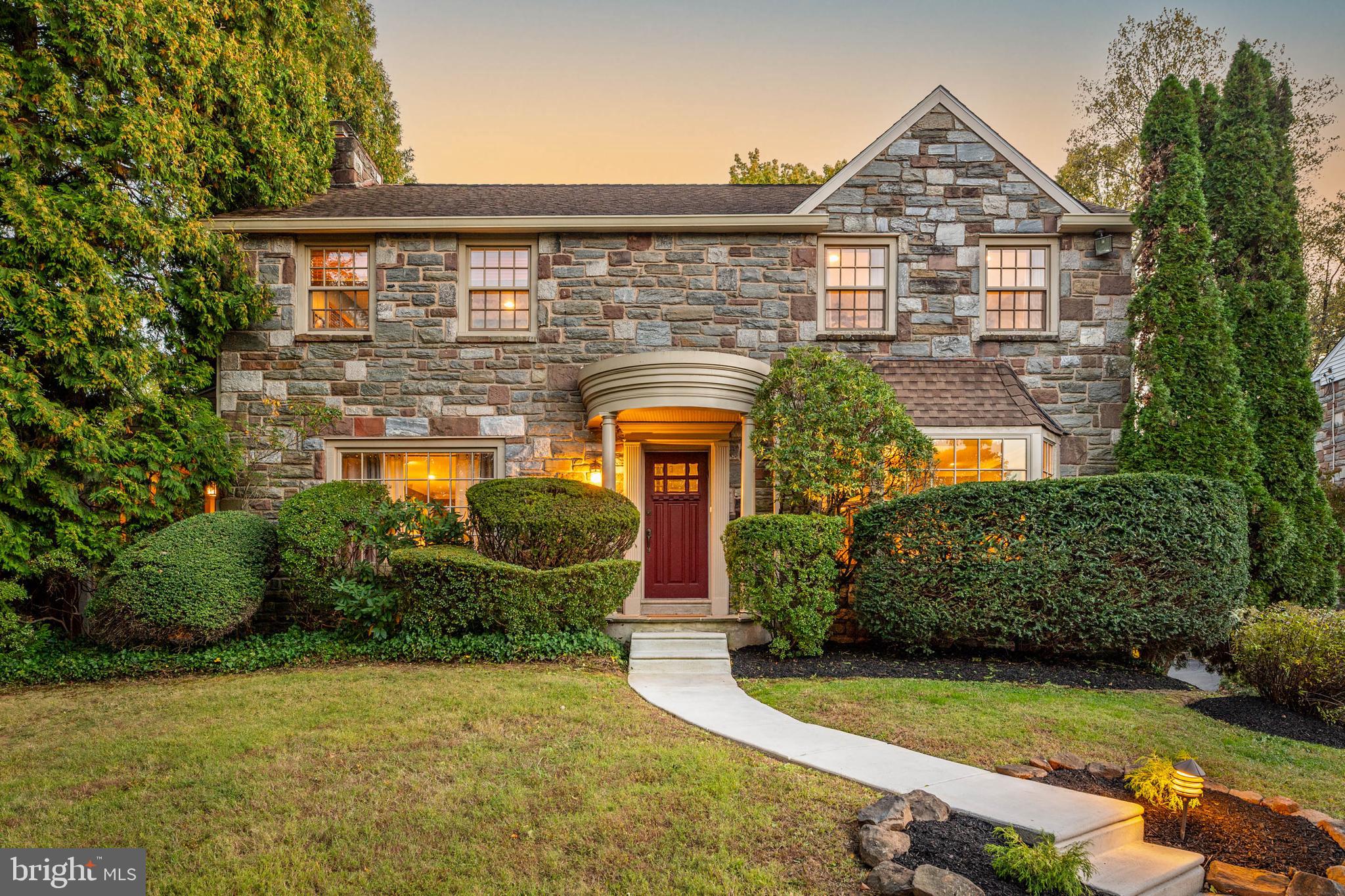 Wynnewood gem. Classic stone colonial perched on a premier corner lot on beloved Clothier Road. Set up off the street, boasting a screened in porch, terrace and flat yard, this home maximizes every inch of its ideal Lower Merion location. Inside, the gracious classic spaces are complimented by thoughtful upgrades ideal for modern day standards. The center-hall entrance welcomes you with beautiful slate-floored foyer, which conveys the home’s enduring character and warmth. To the right, a spacious dining room with beautiful hardwood floors and a bay window overlooks the neighborly street. The renovated eat-in kitchen—expanded by a thoughtful addition—features white cabinetry, quartz countertops, stainless steel appliances, a center island, and a casual dining area. Just off the kitchen, a separate mudroom and adjacent laundry room provide the perfect home edit space.A classic large living room boasts oversize windows, more beautiful hardwood floors and is anchored by a marble accented fireplace with a stately mantle. The living room steps out to a screened-in porch, perfect for morning coffee or summer evenings. The living room opens to a bright, airy family room with glorious natural light and backyard views. This room is spacious enough for both a large sectional and a game table—perfect for relaxing or entertaining. Well placed french doors enhance the natural light between these rooms; one of them leads to the terrace and yard. A stylish powder room completes the first floor.Upstairs, the primary suite offers hardwood floors, graceful curved walls, three closets, and an updated bath with a glass-enclosed shower and double vanity. Three additional bedrooms provide generous closet space and share a beautifully updated hall bath. The finished lower level adds exceptional versatility, with ample space for a media room, home gym, or play area, along with an additional powder room. Award winning Lower Merion School District. Commuter’s dream: half a mile to the Wynnewood train station, half a mile to Wholefoods, Giant and Wynnewood shopping Center. Easy access to all major roadways.