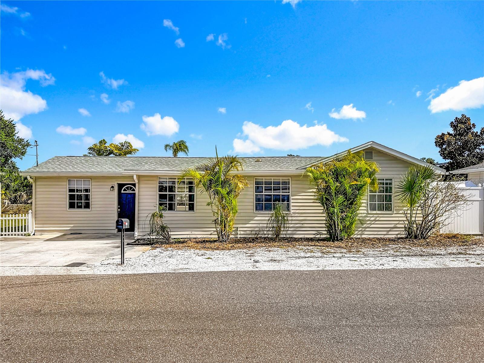 Discover the perfect blend of comfort, style, and prime location minutes from the Gulf of America and NOT in a flood zone at 1125 Michigan Dr N, Dunedin, FL 34698—a charming one-story, 2-bedroom, 2-full-bathroom home with a dedicated office, ideal for remote work or a cozy den. This well-designed residence boasts an inviting floor plan featuring a spacious living room, a separate formal dining room, and a relaxing rear Florida room that seamlessly extends your living space outdoors. The updated kitchen shines with elegant marble counters and modern stainless steel appliances, while both bathrooms have been refreshed for contemporary appeal. Wood-look laminate flooring flows throughout, offering durability and easy maintenance. Step outside to enjoy the expansive oversized fenced lot, providing plenty of privacy and room to play, entertain, or garden, complete with a spacious shed for ample storage.Nestled in the heart of delightful Dunedin, this home offers unbeatable proximity to the vibrant downtown area—just a short stroll or bike ride away—where you'll find eclectic boutiques, artisan shops, acclaimed craft breweries (including Florida's first microbrewery), and a lively scene of independent eateries. Outdoor enthusiasts will love the nearby Fred Marquis Pinellas Trail, a scenic 45-mile paved path perfect for biking, walking, or jogging. Within minutes, reach world-class natural escapes like Honeymoon Island State Park (just a quick drive west via the Dunedin Causeway), featuring pristine white-sand beaches, nature trails through virgin slash pine forests, and pet-friendly areas. Adjacent Caladesi Island State Park offers even more secluded beaches and kayaking adventures. Clearwater Beach, renowned for its sugar-white sands and emerald waters, is only about 7 miles away, while the bustling city of Tampa—offering cultural attractions, dining, and entertainment—is roughly 20-25 miles east. With easy access to these destinations and more within a 20-mile radius, including waterfront parks and the Clearwater Marine Aquarium, this Dunedin gem delivers the ultimate Florida lifestyle of relaxed coastal living and endless nearby exploration.  Peace of mind with 2022 roof and 206 AC.