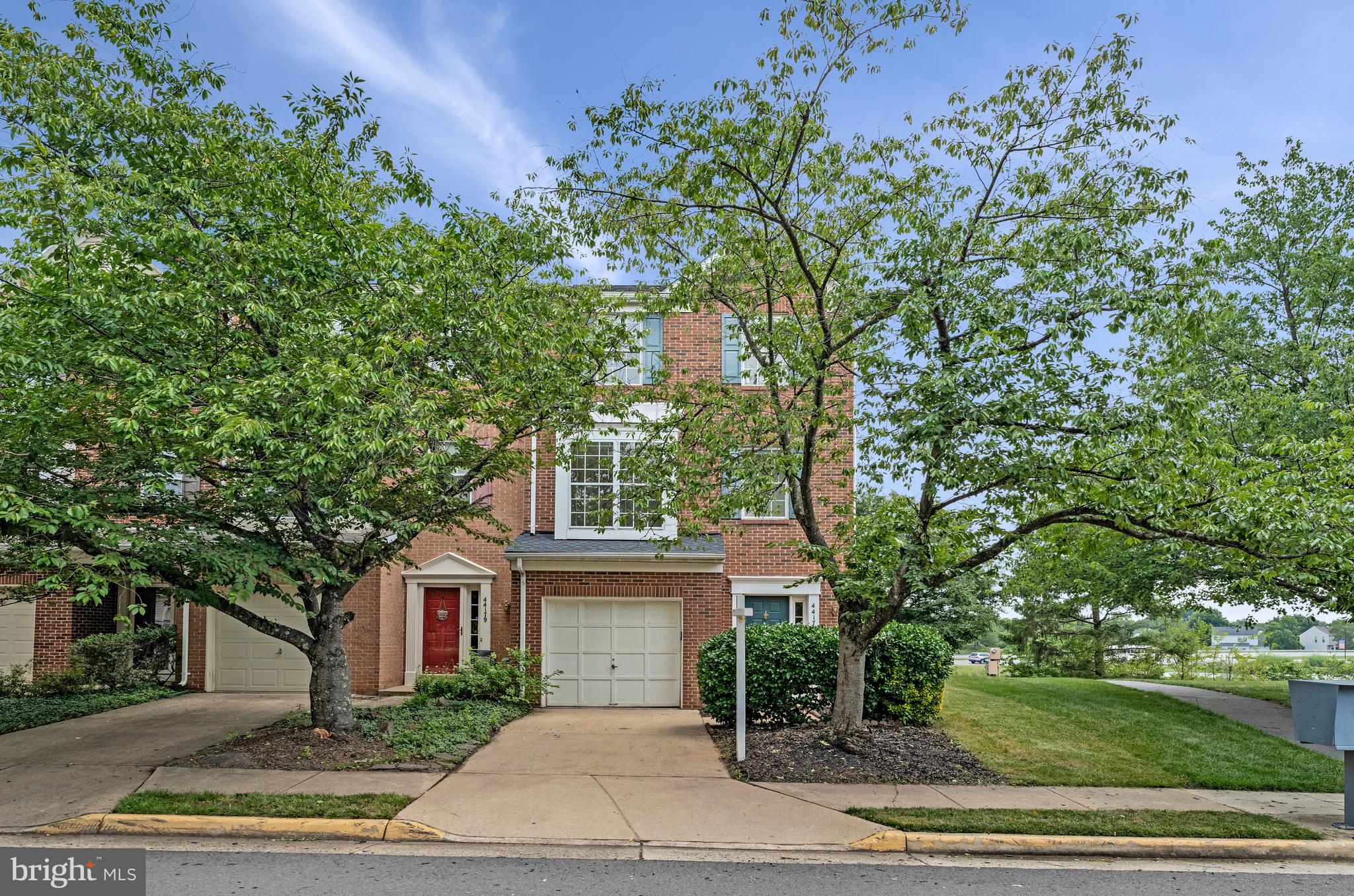 Welcome to 44177 Paget Ter! This beautifully situated end-unit townhome in sought-after Ashburn Village holds a coveted lakefront spot across from the Ashburn Sports Pavilion. Featuring bright and open living spaces, 3 bedrooms, 2.5 bathrooms, a one-car garage, 3-level bump-out, and an unbeatable location in the heart of Ashburn. The lower level entryway is a convenient place to kick off your shoes and either make your way to the spacious rec room with gas fireplace or proceed upstairs to the main living level. The main level boasts a spacious eat-in kitchen with central island, new quartz countertops (2026), new refrigerator (2026), newly painted cabinetry (2026), new sink and gourmet faucet (2026), and newer stove and microwave (2019). The formal dining area can be found directly off the kitchen with gas fireplace and lake views. On the other side of the kitchen is a breakfast nook perfect for informal dining. Off the nook you will find the private rear deck with beautiful lake views that has been newly stained (2026). The home’s 3 bedrooms are found on the upper level with the primary suite at the rear of the home overlooking Pavilion Lake with a generously sized ensuite bathroom with large soaking tub and walk-in shower. The two secondary bedrooms share a large hall full bathroom. In-unit laundry can be found on the lower level. Notable updates: roof (2019), HVAC (2020). Residents of Ashburn Village enjoy access to miles of walking and biking trails, lakes, parks, playgrounds, sports courts, multiple pools, and the renowned Ashburn Village Sports Pavilion with its extensive fitness and recreation amenities. The location is equally impressive with easy access to major commuter routes (7, 28, Dulles Toll Road/Greenway), metro-accessible with the Silver Line, and Dulles International Airport - navigating locally, regionally, and internationally are a breeze. Walking distance to Ashburn Village shopping center with local dining and shopping. And just moments to nearby One Loudoun, Ashburn Station, Ashbrook Commons, the Dulles-28 corridor, and so much more!