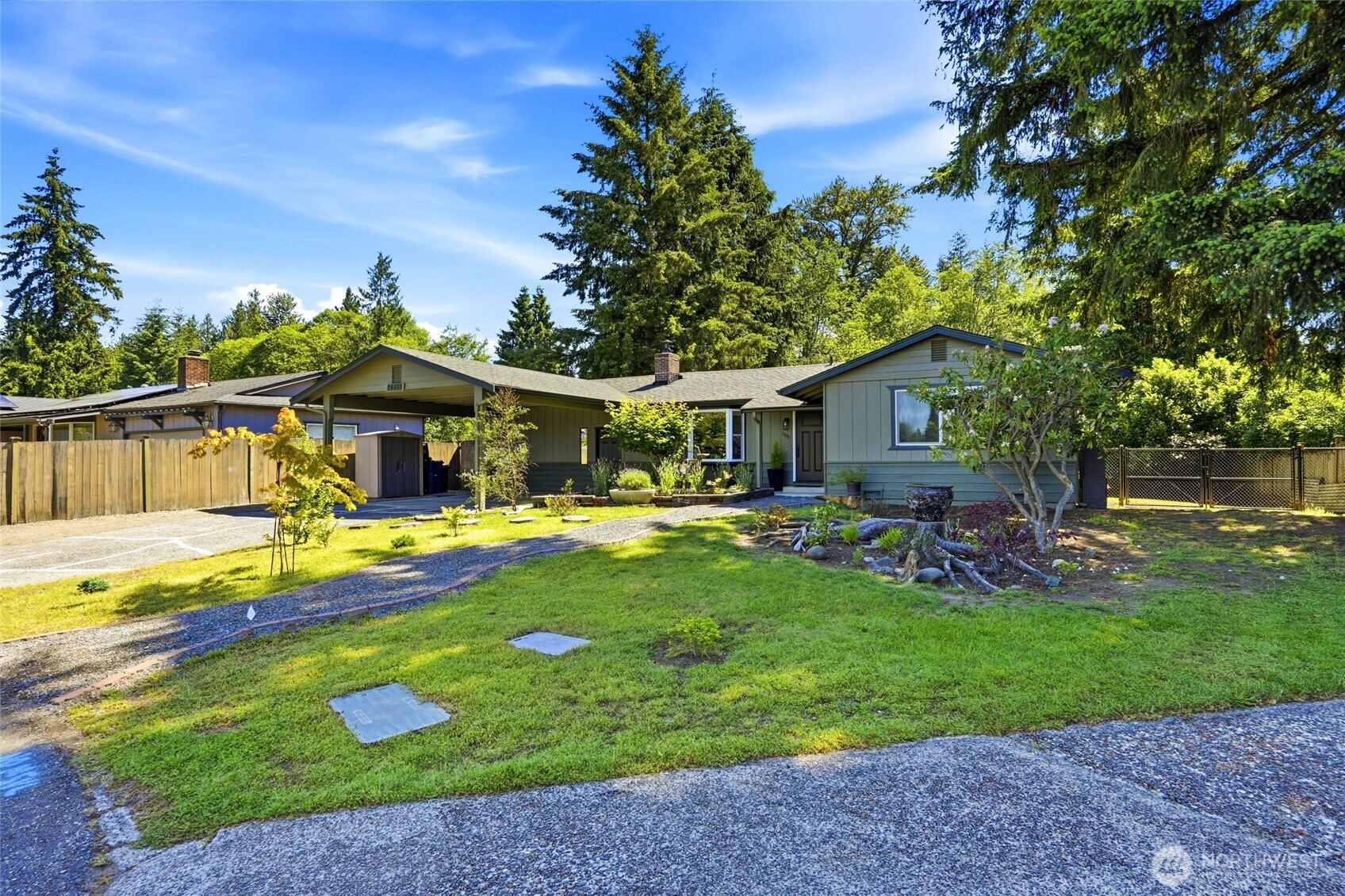 Rare Marysville Rambler on .61 Acres-Privacy, Updates & Natural Beauty! Tucked away on .61 acres, this stunning single-story retreat welcomes you with thoughtful updates from the moment you arrive. At the heart of the home, a showstopper kitchen features granite countertops, stainless appliances, and a generous island-all flowing seamlessly into a sun-filled eating area with a bay window. Cozy up by the fireplace or gather in the spacious family room, complete with a propane stove for efficient supplemental heat. (Go Hawks-your screams and cheers are safe here!) Three well-appointed bedrooms and 1.75 beautifully updated baths round out the interior. Step outside onto the updated deck and let your imagination take over — lush, peaceful grounds, a meandering creek, and incredible bird watching create a private oasis unlike anything else in this price range. Perfect for those neighborhood ball games!The backyard delivers serious function too: a 12x24 shop with loft(fully insulated), two additional sheds, and potential RV parking. Major updates include a roof (~7 years), exterior paint (2024), new front door, new kitchen and a new electrical panel(with space to add on eg.Swim Spa)-the big-ticket items are already done! This is the one-level lifestyle you've been waiting for.