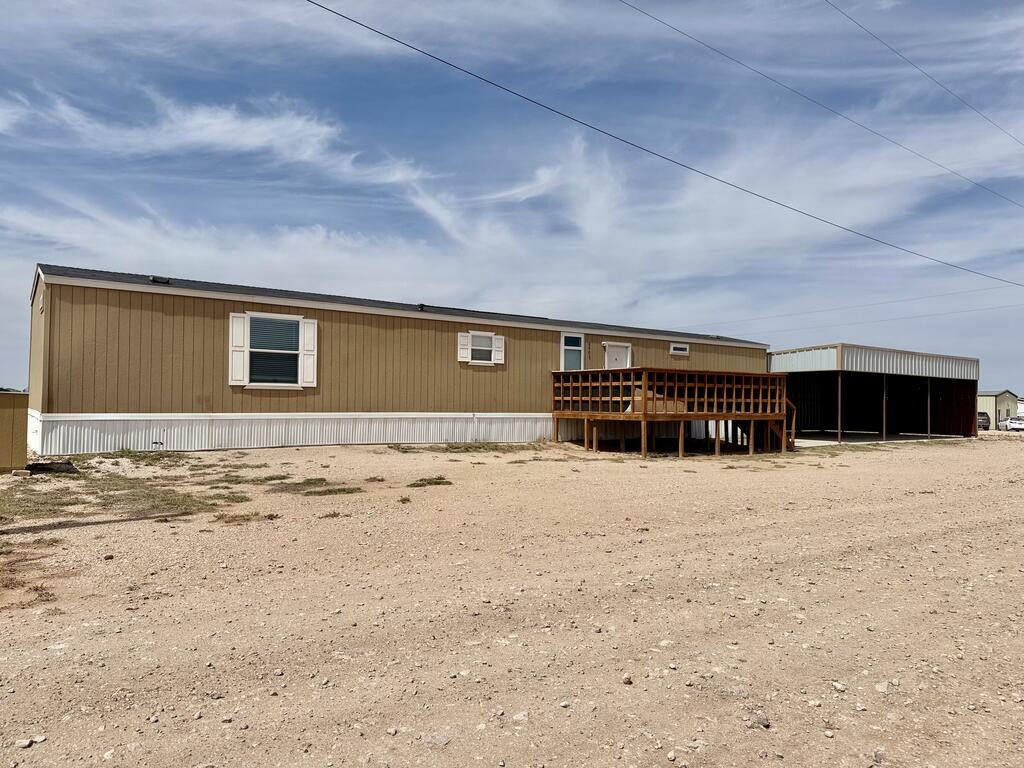Welcome home to this beautifully maintained 3-bedroom, 2-bath manufactured home situated on approximately 0.61 acres in Midland. Featuring fresh neutral finishes, wood-look plank flooring throughout the main living areas, and plush carpeting in the bedrooms, this home offers comfort and modern appeal. The open-concept kitchen boasts rich espresso cabinetry. Outside, enjoy the large covered wooden deck, carport, and fully fenced yard with a dedicated pet/play area featuring artificial turf. Detached carport complete the package. This move-in ready home is perfect for space  !