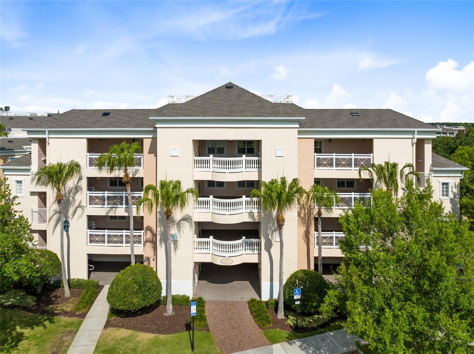 RARE OPPORTUNITY to own a TOP FLOOR CORNER UNIT with an ACTIVE TRANSFERRABLE MEMBERSHIP.  This FULLY FURNISHED 3 Bedroom 3 Full Bath Condo has beautiful lush trees providing a nice sense of privacy while you're enjoying your spacious covered lanai.  Recent updates to this amazing condo include NEW Luxury Vinyl flooring (2021), NEW Air Conditioner 2023, NEW Refrigerator and Dishwasher (2021), NEW Microwave (2025), NEW Smart Tv's in all bedrooms (2021), NEW fixtures in all bathrooms and master shower and NEW keyless door locks on the owner's closet, front hallway linen closet, front door and outside storage closet for more convenience.  It has additional windows along the side that provide an abundance of natural light throughout the day. The Kitchen boasts Granite Countertops, and Hardwood Cabinets with Crown Moulding. The Primary suites is equipped with a Garden tub, walk in shower, Hardwood Cabinets with Granite Countertops. In addition you also have private access to the covered lanai.  As an added bonus this condo has additional storage adjacent to the unit only available with corner units. This condo can be a primary residence, second home or vacation rental property. Centre Court Ridge is one of the most desirable communities in Reunion. It location is fantastic as you are walking distance to the Reunion Grande, Clubhouse and Pro Shop. This community also offers a Putt Putt golf course, hot tub, playground, sand volleyball pit, Tennis courts & Pro Shop all which are in close proximity to this condo. Reunion Resort is a 2,300 acre Private Golf and Tennis Community, just 6 miles to Disney and the parks, and a short drive to the Orlando International Airport.