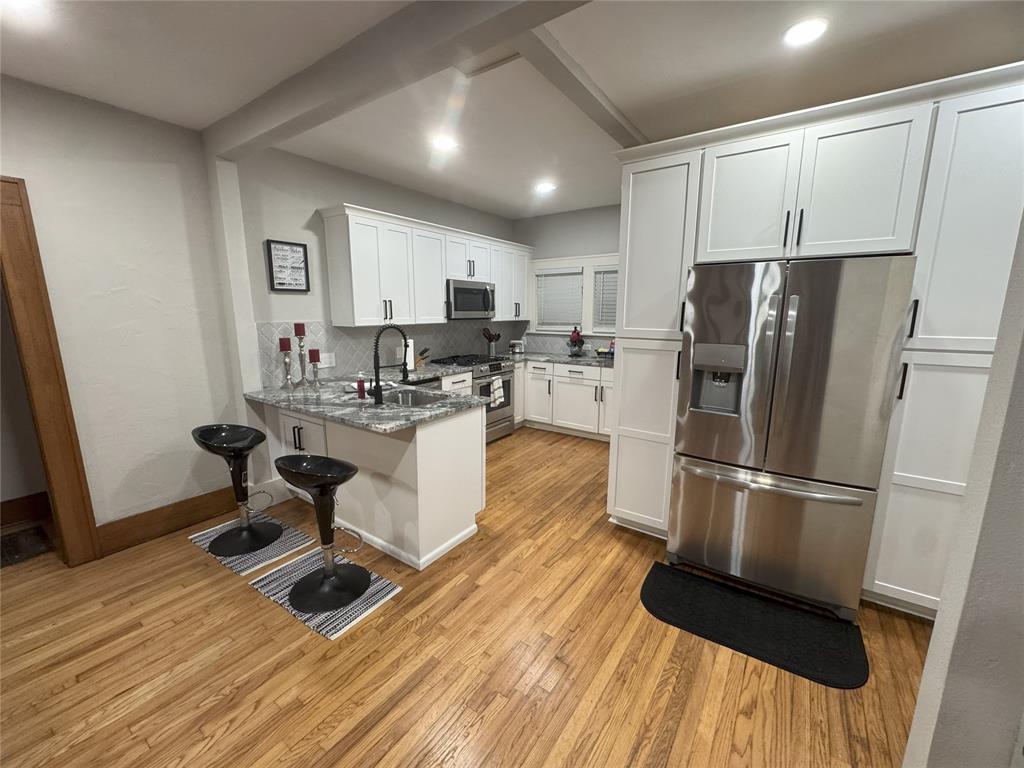 Campus Area | Rare 3 Homes on One Lot | 5 Bedrooms | 3 Baths | Multiple Income OptionsExceptional opportunity in Norman’s highly desirable Campus Corner district—three separate residences on one lot offering outstanding flexibility for owner-occupants, investors, or OU game-day buyers. This walkable location places you just minutes from OU campus, Campus Corner, The Mont, Downtown, restaurants, and nightlife.Home #1 – Remodeled Craftsman (2 Bed/1 Bath): This beautifully remodeled craftsman blends timeless character with modern upgrades. Inside, you’ll find an open and inviting layout with refinished original red oak hardwood floors, natural light, and stylish finishes throughout. The brand-new designer kitchen features top-of-the-line cabinets, granite countertops, updated hardware, self-closing drawers and doors, new plumbing fixtures, a French stainless-steel refrigerator, gas stainless cooktop, and electric oven—ideal for everyday living or entertaining. Beyond the cosmetics, the home has been fully modernized with updated plumbing, electrical, HVAC, and a new water heater, offering long-term comfort and peace of mind. Home #2 – Garage Apartment (1 Bed / 1 Bath):Cute, cozy, and functional, this garage apartment is perfect for a student, au pair, guest suite, or rental. It includes a full bathroom, large closet, stove, oven, and refrigerator.Home #3 – Secondary Residence (2 Bed / 1 Bath):This charming home features original red oak hardwood floors, a nicely sized kitchen, washer and dryer, small backyard, side patio, and welcoming front porch—ideal for long-term living or additional rental flexibility. If you’re seeking a live-in-one, rent-the-others setup, a turnkey multi-unit investment, or a high-demand game-day retreat, this property delivers character, versatility, and location. Opportunities like this in the Campus Corner area are extremely rare—don’t miss your chance to own multiple homes in one of Norman’s most vibrant and walkable neighborhoods.