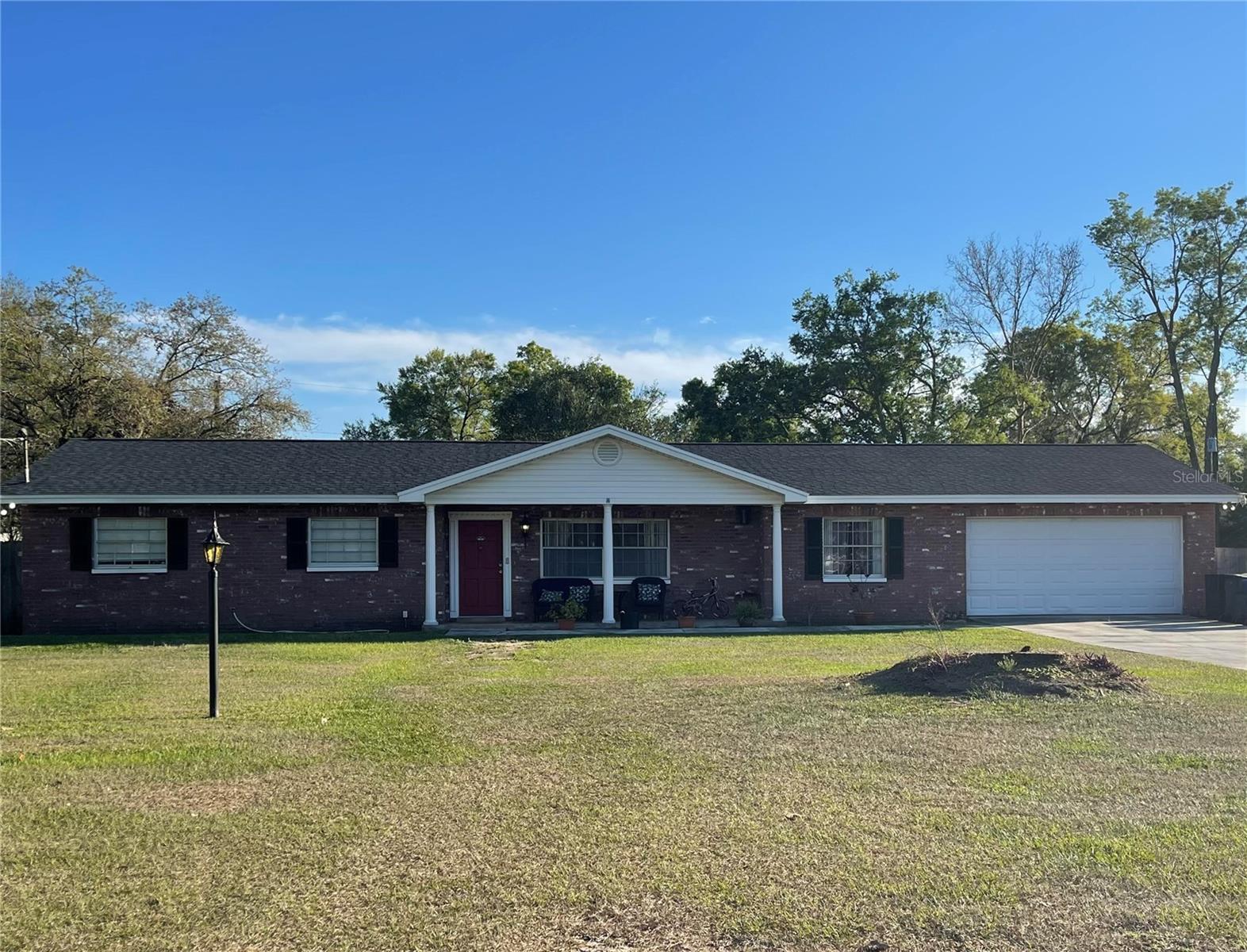 Classic Florida ranch style home sits on a rare .76-acre lot in the heart of Brandon. This solid block home with brick façade offers space, flexibility, and peace of mind with major updates already completed — including a 2022 roof, 2019 HVAC, cast iron plumbing replacement (2020), and new well pump and tank (2024).The functional 3-bedroom, 2-bath layout features 1,551 sq ft of living space and a thoughtfully upgraded primary bath with roll-in shower, ideal for accessibility or aging-in-place. Enjoy both a covered front porch and a screened back porch with new screening (2023) overlooking the expansive backyard. Outdoor living continues with an above-ground pool with deck, umbrella, and upgraded steps, perfect for relaxing or entertaining.Parking and storage are a standout with a 2-car garage, 4+ car driveway, and plenty of room for an RV, boat, trailer, or work vehicles — all with NO HOA. The oversized lot offers privacy, usability, and endless possibilities rarely found in this location.Conveniently located near Downtown Tampa, the Riverwalk, Tampa International Airport, MacDill AFB, Raymond James Stadium, shopping, dining, and entertainment — plus easy access to Florida’s Gulf Coast beaches. A rare opportunity to own land, freedom, and long-term value in an established neighborhood.