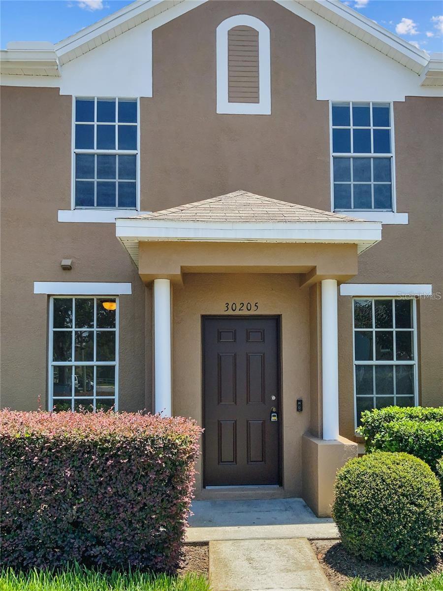 Priced to sell.  Experience the best of Wesley Chapel living in this 3BR/2.5BA townhome in gated Charlesworth. This "move-in ready" home boasts all-new paint, wood floors, brand new carpet, plus a rare private lanai with a serene conservation view.  Located in the heart of the action, you’re minutes from the New Tampa border and the brand-new shopping hub featuring Whole Foods. Enjoy maintenance-free living and access to Meadow Pointe’s premier amenities: a clubhouse, gym, pool, and sports courts. With A-rated schools and a history of high demand this is the first Charlesworth listing in over a year.  This home won't last long. HOA includes roof