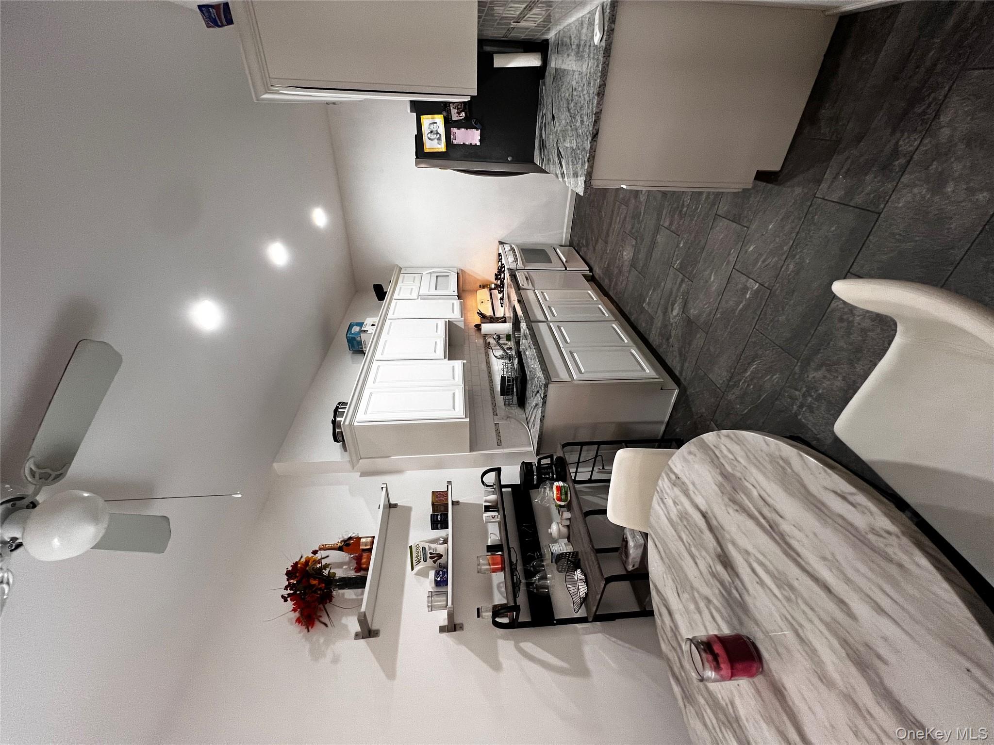 Spacious 2-bedroom co-op in the heart of Hartsdale! This oversized unit offers approximately 1,200 sq. ft. of living space, featuring a kitchen with granite countertops, recessed lighting, wood-grain tile flooring, and a decorative tile backsplash. The bathroom includes both a separate bathtub and a stand-alone shower. Enjoy ample storage with four large closets! The living room is enhanced with custom motorized blinds and this unit comes with an assigned parking space. 

Hartsdale Gardens is a beautifully maintained prewar building with a live-in superintendent and a full-time porter, ensuring a spotless environment. Residents can take advantage of amenities such as a playground, basketball court, BBQ/picnic area, and a full-size card-operated laundry facility with carts. Conveniently located just minutes from Hartsdale Village and the the Hartsdale MetroNorth station with an easy 35-minute train ride to Grand Central Terminal. Nearby shopping includes Trader Joe’s, Starbucks, and Home Goods