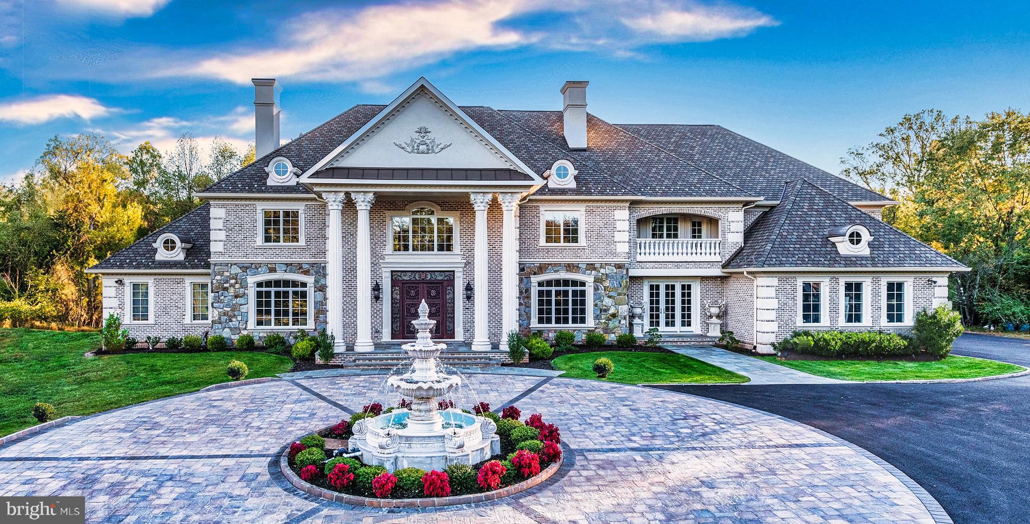 Once in a lifetime opportunity to own one of the finest estates in the greater Washington area. The magnificent Blue Ridge Manor is inspired by the finest European design and architecture, and offers unparalleled distinction and prominence. Discretely sited on a gated 5-acre lot in prestigious Great Falls, Virginia, this sublime 16,000 square foot resort-like estate offers exceptional luxury. Custom iron gates introduce a long-private driveway which leads to a private parking court and dramatic marble fountain. Stepping through the custom bronze doors, one is struck by both the grandeur of the home as well as the finest of details which are immediately evident. Hand-crafted plaster moldings, dazzling, custom made chandeliers and bespoke millwork reveal the unequivocal attention to detail this masterpiece holds. Over two years in the making, this sophisticated estate offers three kitchens, including a separate spice kitchen and large kitchen in the attached guest quarters, nine bedrooms, nine full baths and four half baths. The public rooms include an elegant formal living room and dining room, perfect for grand scale entertaining, as well as a stately library with coffered ceilings and custom bookcases. A true chef’s kitchen, complete with marble countertops and hand-crafted, custom cabinetry is handsomely complimented with a convenient breakfast area overlooking the serene, private backyard. The chef’s kitchen also opens to an inviting family room with soaring ceilings, a regal fireplace and French doors which lead to the outdoor stone balcony overlooking the exquisite setting and opulent pool. The main level also hosts a screening/media room, as well as an estate manager’s office with a separate entrance near the driveway for added convenience and privacy. Upstairs, the sumptuous private owner’s suite features a sitting room, an exquisite owner’s suite bath and separate dressing room, all designed to pamper every indulgence.The bright, welcoming walk out lower level boasts a sprawling recreation room with a wine cellar and a fully appointed wet bar overlooking the uniquely private views of the backyard oasis. The list of luxurious amenities continues with a private spa complete with a sauna, fitness studio and massage room, as well as a gift-wrapping room. A separate, two level, two-bedroom guest quarters is located in an adjoining wing of the estate to provide added privacy. When you step outside this grand estate, you enter a world of your own. The beautiful grounds, both lush and private, are the perfect backdrop to this peaceful retreat. Amid the gardens and towering trees is an expansive space for entertaining, with a glittering pool with laser jet fountains, a waterfall and mesmerizing fire bowls, as well as a private putting green. Blue Ridge Manor is in a location that is convenient to the entire Washington area. Located just outside of Washington, DC and merely 10 minutes from the dynamic urban hub of Tysons Corner, 5 minutes to downtown Reston, and 15 minutes to Dulles airport. Blue Ridge Manor is truly a one-of-a-kind estate of global significance and one that cannot be duplicated. Shown by appointment. CHECK OUT THE 3D Matterport Tour & YouTube Video!