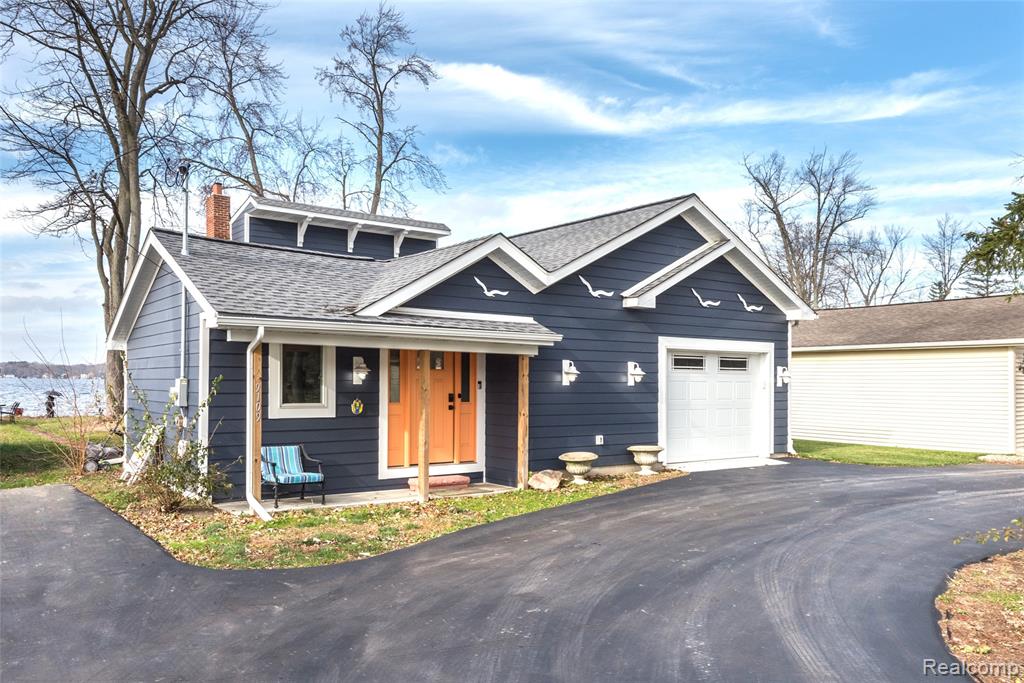 Extensively remodeled lake front home on Portage Lake on the Portage Chain of Lakes - with an additional, huge vacant lot!   This lake home comes with 45' of Portage Lake frontage, a wonderful sunset exposure, shallow contour sand and gravel lake bottom - perfect for your lakefront life!   Boat, tube, ski, fish, wade, kayak, sail or just sit on your lakefront and enjoy the prevailing southwest summer breezes.  Remodel includes James Hardy siding, complete encapsulation of crawlspace, expanded utilization of square footage, garage, and much more.  The absolute smartest lakefront buyers are buying lake houses during the fictitious "off season".  Don't miss this one!