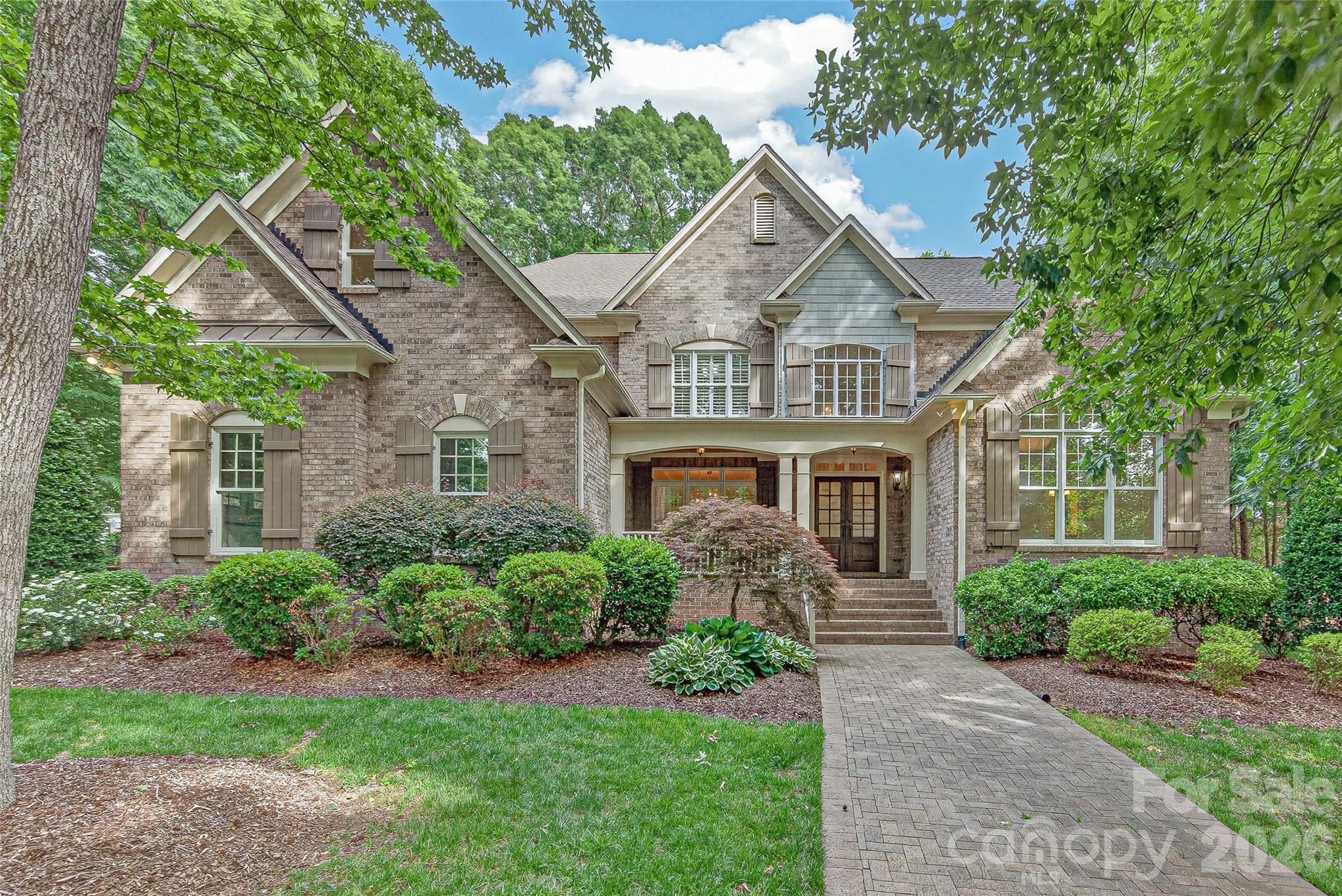 1.2 ACRES... 8 BEDROOM ESTATE... Primary and Guest Suite on Main... Pool, Cabana, Privacy, Large Fenced Yard...  Sought-After MARVIN SCHOOL DISTRICT... at Cul-de-sac...  WYNDHAM HALL... Wow... This One Checks All The Boxes!!! QUALITY CRAFTSMANSHIP & PRIDE OF OWNERSHIP Are Reflected in All Details. Complete Privacy Surrounds the Beautiful BACKYARD OASIS With Inground Pool & Cabana. The Front Porch, Side Porch & Rear Screened Porch, Accessed From the Great Room, Kitchen, and Primary Suite, Creates Seamless INDOOR-OUTDOOR LIVING. The Pool Area Conveniently Enjoys Direct Access to Half-Bath and Kitchen, Making Entertaining a Breeze. Thoughtful Floorplan With Primary Suite & Private Guest Suite on Main Provides FLEXIBILITY FOR MULTIGENERATIONAL LIVING! The Gracious Front Porch Opens to the Dining Room & Reception Hall, Which Leads to the Great Room with Fireplace & Built-Ins... Half-Bath... Butlers Pantry & Gourmet Kitchen with Large Island & Casual Dining Area - Perfect for Entertaining! Also Off the Kitchen is Additional Family Room with Built-Ins... Half-Bath... Office Area... Drop Zone with Bench, Hooks & Cubbies... Laundry Room With Sink & Built-In Storage... Pantry/Storage Closet... Side Porch w/Keypad Entry & Direct Entry From 3-Car Garage. Dual Staircases Lead to the Upper Level Hallway with Hardwood Floors... Six Secondary Bedrooms... Permanent Steps Leading to Attic storage space. Beautifully Refinished Hardwood Floors, NEW ROOF (2026), Storage Cabinets in Garage. Close to Waverly, Rea Village, Blakeney, The Fountains & More for Fabulous Shopping, Dining, Medical, Grocery, Salons, Etc!!! Also Convenient to I-485, Lifetime Fitness, Providence Country Club, Longview Country Club and so much more! A RARE FIND!!!