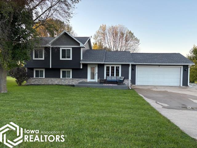 Best of both worlds!  Serene rural setting just a few minutes from town.  Enjoy over 2400 square feet of living space, TWO family rooms plus a formal living, open floor plan - perfect for entertaining, primary suite, three additional bedrooms, walk-out lower level, deck, heated workshop and additional storage building.  And best of all......country feel on a hard surfaced road.  Additional perks include expanded parking and geothermal heating.  Call today and take a look!