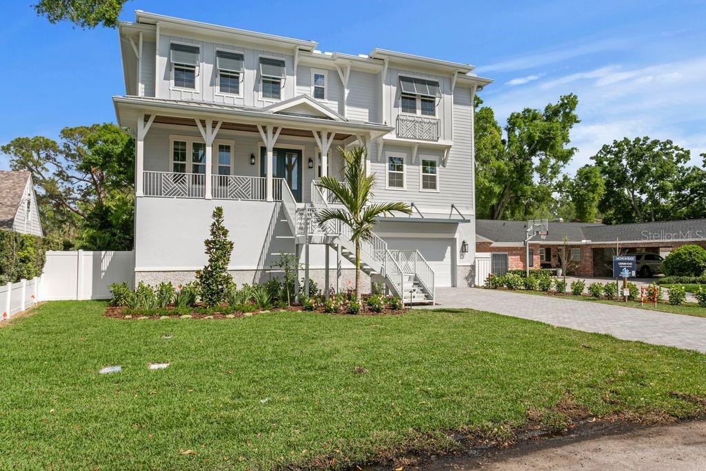 NEW CONSTRUCTION: SUNSET PARK MASTERPIECE – YOUR NEW HOME AWAITS. Crafted by New Legacy Homes, this forthcoming 5,500+ square foot estate redefines luxury living in South Tampa’s coveted Mabry, Coleman, and Plant school district. Thoughtfully designed with five bedrooms, five and a half bathrooms, a media room, study, elevator, and expansive 2,000+ sqft flex space, this residence blends timeless architecture with modern functionality.Enter through a grand two-story foyer, flanked by a refined home office and designer powder bath. The heart of the home showcases a chef’s kitchen outfitted with Thermador appliances, including a 48” gas cooktop with pot filler, dual ovens, and floor-to-ceiling custom cabinetry. A striking oversized island connects seamlessly to the breakfast area, formal dining room with a glass-enclosed wine display, and the spacious great room, which opens to a covered lanai with a fully equipped outdoor kitchen. A well-appointed prep pantry with a full-size secondary refrigerator and a large first-floor laundry room add both functionality and convenience. The first floor also features an expansive bonus room, currently staged with a ping pong table and sitting area, offering a versatile space for entertaining or relaxation.Take the rear staircase or private elevator down to a one-of-a-kind under-home entertaining level with drive-through garage door access, offering over 2,000 square feet of flexible space beneath the elevated main living floor. The pool begins beyond the footprint of the home and extends underneath, creating a dramatic resort-style setting that remains shaded and enjoyable year-round. A dedicated turf area is already in place, ideal for a putting green, ping pong, or cornhole, with additional space for a personal gym or wellness features such as a sauna or cold plunge. Designed for both entertaining and everyday enjoyment, this level offers a truly unique extension of the home’s living space.Upstairs, the primary suite is a true sanctuary, complete with tray ceilings, a spa-like bathroom featuring a soaking tub and walk-in shower, and dual custom walk-in closets, including a private primary closet with direct access to the second-floor laundry. Just outside the suite, a wet bar with a beverage fridge adds convenience and comfort to your morning routine or evening wind-down. Three additional en-suite bedrooms and a flexible bonus space complete the upper level, along with a second expansive bonus room featuring a full wet bar, ideal for entertaining, media, or additional lounge space.Every detail of this home reflects quality, from impact-resistant windows and doors to a gas fireplace, smart home automation, solid core 8’ doors, level 5 smooth drywall, custom moldings, and energy-efficient construction featuring Icynene spray foam insulation and Hardie siding. Situated in the heart of Sunset Park, you are moments from South Tampa’s best boutique shopping, top-rated dining, waterfront parks, and Tampa International Airport.Some photos have been virtually staged.This home is more than new construction; it’s the foundation for your next chapter of elevated living.PREFERRED LENDER CREDIT AVAILABLE (UP TO $5,000)!