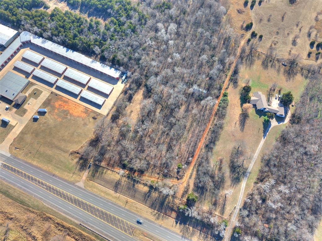 This 4.25 acres presents a great opportunity for commercial development. This prime location offers high visibility with frontage on State Hwy 9. The 4.25 acres could accommodate a wide range of commercial or industrial uses. Located just west of the popular Riverwind Casino and within a high traffic commercial area this property is an ideal location for users seeking to develop or expand in a growing market. Goldsby water on property boundary for easy access. The water line easement is along the front (north) and western boundaries. Property lines on photo are not exact. Survey is available.