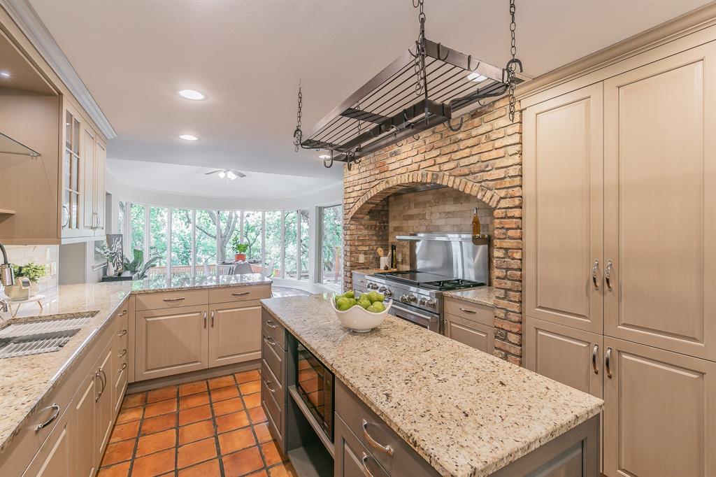 Stunning Hilltop Retreat with Breathtaking Views Perched atop a scenic hill and nestled on a lush, heavily wooded lot, this extraordinary home offers the perfect blend of nature, luxury, and thoughtful design. Enjoy panoramic views and serene privacy from multiple outdoor living areas, including a sparkling pool surrounded by expansive decking—ideal for both relaxing and entertaining. Inside, the gourmet kitchen is a chef’s dream, featuring a premium Wolf gas range, seamlessly built-in sub zero fridge - freezer and Cove dishwasher, granite countertops, high-end custom cabinetry, and a spacious center island. Upscale finishes continue throughout the home, including beautifully crafted cabinetry in both the kitchen, laundry and bathrooms. The upstairs living area is a standout space, complete with a second stone fireplace, built-in cabinetry, and an oversized wet bar—perfect for hosting guests. Upstairs also features three bedrooms: one with its own en-suite bath and private access to the balcony, and two others that share a unique Jack-and-Jill style bath—each with its own private vanity and toilet, connected by a shared shower. The owners’ retreat is a luxurious haven, boasting a spacious en-suite with a garden tub, separate shower, dual vanities, and abundant storage. Additional highlights include a large laundry room with a convenient folding area and built-in desk, as well as a main-level half bath that’s perfectly positioned for easy access from the pool—ideal for outdoor gatherings. This remarkable property offers the feel of a peaceful woodland escape while delivering the refined comforts of an executive home. Don’t miss this rare opportunity to own a private oasis with spectacular views and premium amenities.