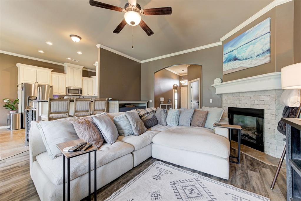 Welcome to this beautiful home in the highly desirable Cedar Lane community, offering outstanding neighborhood amenities including a park, fishing pond, clubhouse, and community pool.This versatile floor plan features 4 bedrooms plus a dedicated home office, providing flexibility for today's lifestyle. The oversized fourth bedroom (17' x 10') can easily serve as a media room, playroom, home gym, or second living area.Inside, you'll find quality finishes throughout, including 3 cm granite countertops, tiled hallways, stainless steel appliances, a gas range, and abundant white cabinetry for exceptional storage. The open-concept living area is tucked away from the entry, creating a warm and inviting space centered around a beautiful fireplace—perfect for entertaining family and friends.Step outside and you'll discover one of this home's most unique features—a fully powered storage building complete with air conditioning. Whether you need a workshop, hobby space, home office, workout room, or simply climate-controlled storage, this versatile space offers endless possibilities. The backyard also features a covered patio and fire pit, creating the perfect setting for relaxing evenings or gathering with family and friends.The spacious primary suite provides a private retreat with dual vanities, a large walk-in shower, and a soaking tub. Additional features include an in-ground storm shelter conveniently located in the garage floor, providing added peace of mind during Oklahoma storm season.Conveniently located just minutes from the OU campus, shopping, dining, and served by award-winning Norman Public Schools, this home offers the perfect combination of comfort, style, and functionality.Schedule your private showing today and experience everything this exceptional home has to offer!