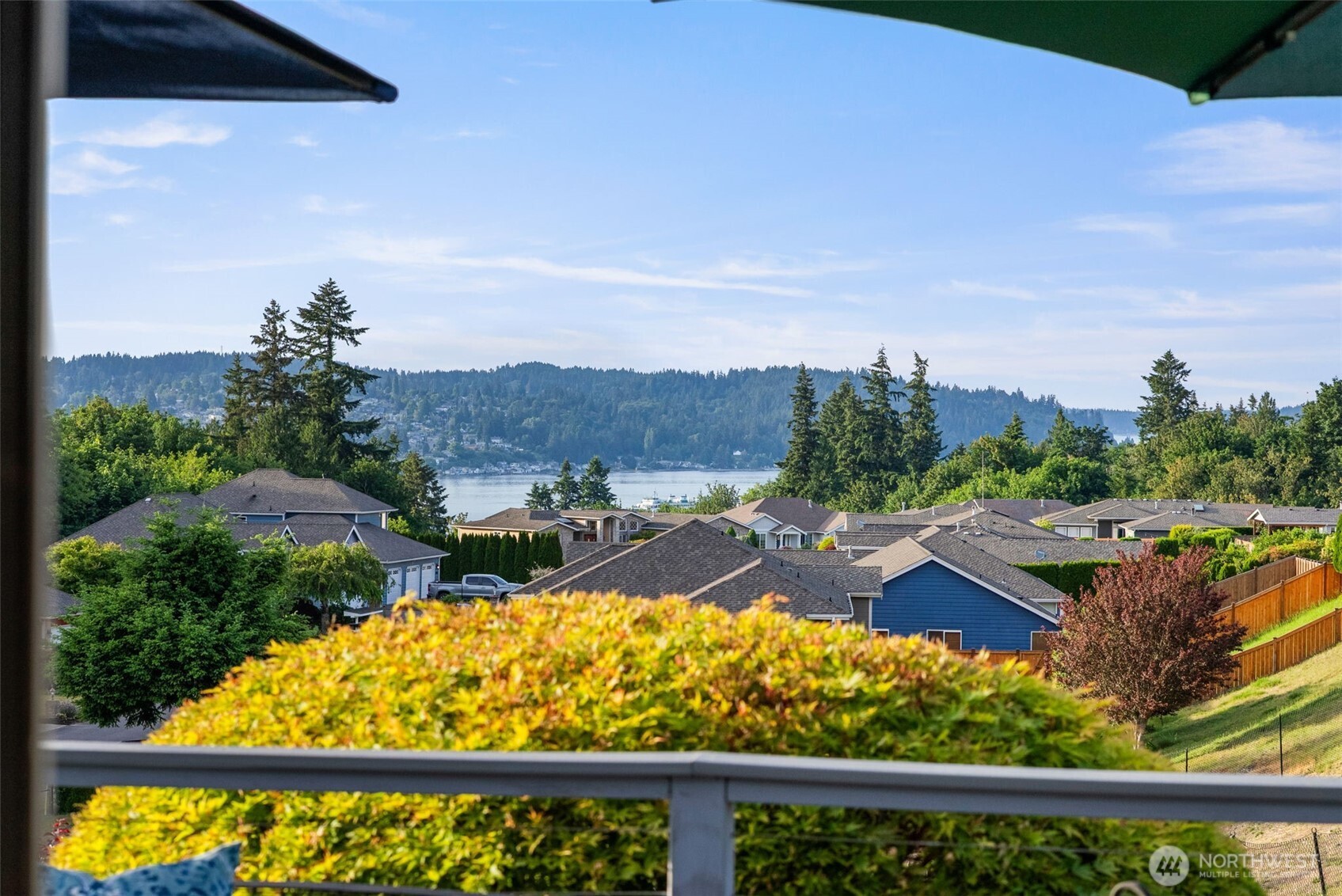 Wake up to sweeping 180-degree views of the Puget Sound and Olympic Mountains from this beautifully maintained rambler in sought-after Sinclair Heights. Perfectly positioned to capture ever-changing scenery, you'll enjoy a front-row seat to ferries, sailboats, naval vessels, and spectacular sunsets that transform the mountains throughout the seasons.    Designed for both comfortable everyday living and effortless entertaining, this 1,749 square foot home features 3 bedrooms, 2 bathrooms, vaulted ceilings, and expansive windows that showcase the panoramic views from nearly every room. The open-concept living and dining areas create a bright, inviting atmosphere where the natural beauty outside becomes part of the home's everyday experience.    This home provides modern comfort and peace of mind with quartz countertops, stainless steel appliances, fresh interior paint, newer furnace, water heater, central air conditioning, and beautifully landscaped grounds.    Whether you're working from home with an inspiring backdrop, enjoying morning coffee as boats glide across the inlet, hosting friends for sunset gatherings, or simply relaxing at the end of the day, this exceptional property offers the lifestyle many dream about and few get to enjoy. Rarely does a home combine single-level living, move-in-ready updates, and such captivating Pacific Northwest views in one remarkable package. Come take a look before it's gone!