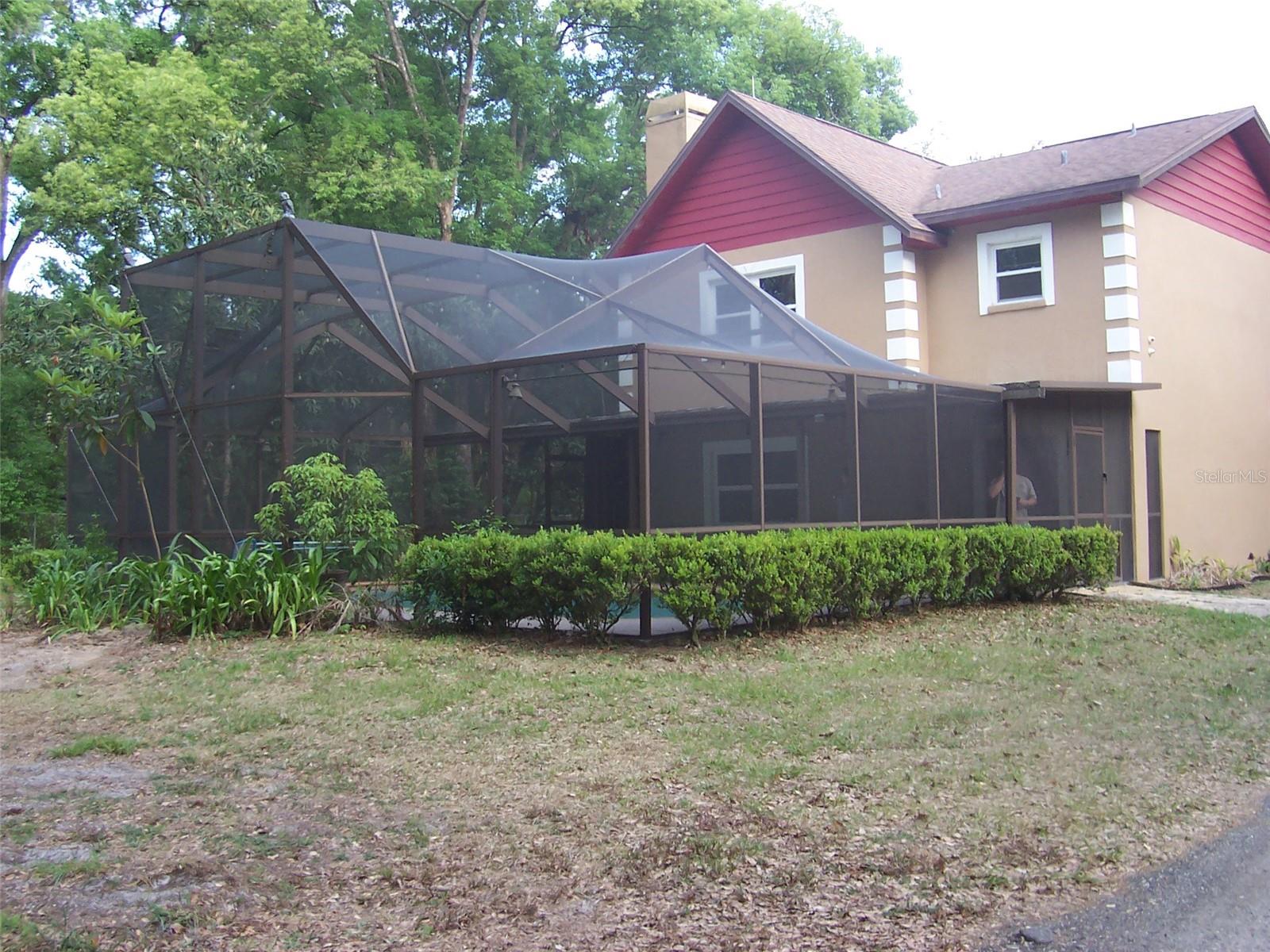 3 bedrooms, 2.5 bath home with an inground pool all located on 2.5 acres of fenced privacy.  The driveway takes you through the serene wood acreage to this Country Charmer.  This property features an inground pool, large outbuilding for storage of big toys, lawn equipment AND an eye catching decorative hen house!!!  House is of solid construction featuring concrete block from the ground to the roof.  House features a large country kitchen with loads of cabinet space and room for a kitchen table as well.  The kitchen pantry is amazing.  The kitchen is convenient to the formal Dining Room.  A half bath is located downstairs for guest convenience.   Living Room features a gorgeous stone wood burning fireplace with wood mantle.  Inground pool features summer fun and the fireplace features winter warmth.  The beautiful stairway leads you to the three spacious bedrooms.  Owners Bedroom features a double closet and overlooks the front of the house.  Owner's bath has been updated and features a 3 head walk in shower.   The 2nd and 3rd bedrooms overlook the backyard.  A spacious full bath with shower/tub combo is located in the upstairs hallway.  This 2.5 acre gated property has great features.  Some of the upgrades include updated windows and AC unit.  The roof was installed in 2017.  So secluded yet convenient access to Tampa or Lakeland and all major highways.