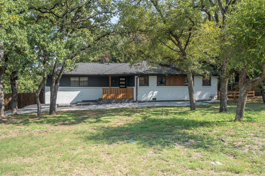 Welcome home! This inviting one-story gem in Fort Worth perfectly blends comfort, convenience, and timeless charm, offering thoughtfully updated spaces in a peaceful setting. From the moment you arrive, you’ll be drawn in by the charming covered front porch with plenty of room for seating—an ideal spot to sip your morning coffee or greet neighbors as the day begins. Mature trees frame the property, providing shade, beauty, and a sense of established character that newer neighborhoods can’t always match. Inside, you’ll find the living area filled with natural light, accented by updated fixtures and a welcoming flow that connects seamlessly to the dining space. Whether you’re hosting holiday gatherings, casual dinners, or simply enjoying a quiet evening at home, the open layout makes every moment feel effortless. The heart of the home is the freshly remodeled kitchen, where modern finishes meet everyday functionality. Updated countertops and a thoughtfully designed layout make this space as stylish as it is practical—perfect for both seasoned chefs and busy families on the go. Retreat at the end of the day to the light and airy primary suite, complete with a beautifully remodeled ensuite bathroom. Two additional bedrooms provide incredible versatility—use them as guest rooms, a playroom, or a home office to fit your lifestyle. Step outside and you’ll discover a large backyard with endless potential. A spacious deck sets the stage for weekend barbecues, outdoor gatherings, or simply unwinding in the fresh air. Location is another highlight—this home is conveniently close to schools, major retail, and dining options, ensuring everything you need is just minutes away. Plus, easy access to Highway 820 makes commuting or exploring all that Fort Worth has to offer simple and stress-free. With its combination of updates, character, and unbeatable location, this Fort Worth treasure truly has it all. Don’t miss your chance to make this beautiful home yours today!