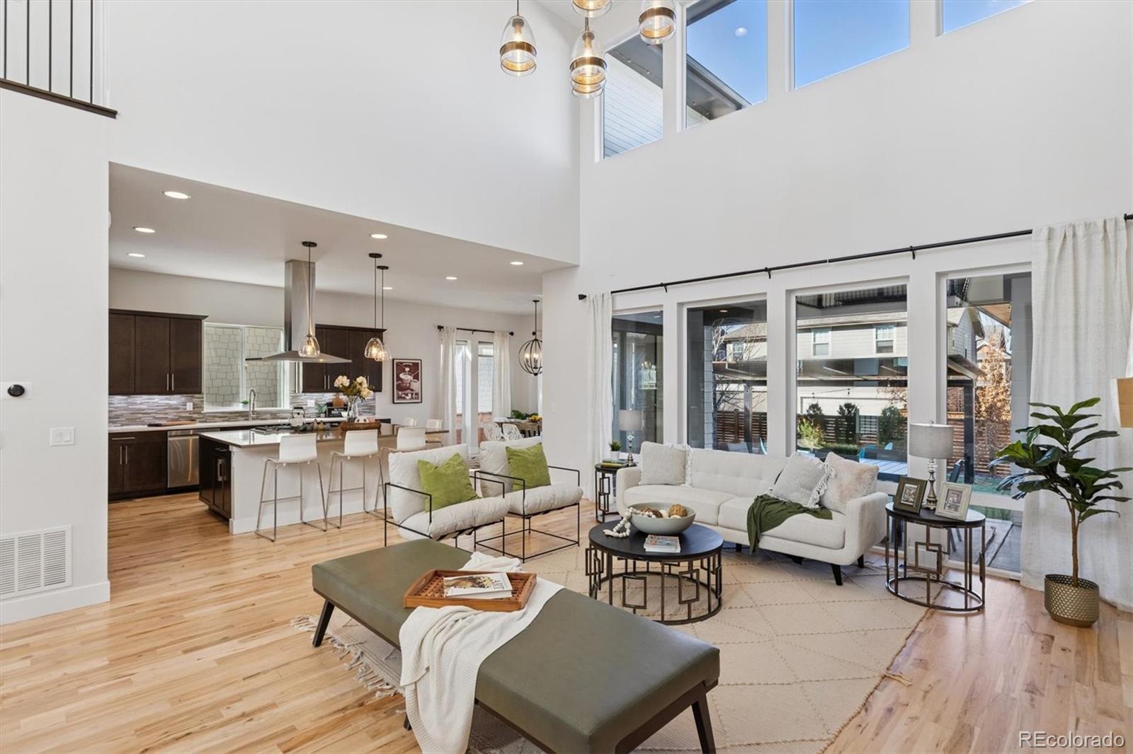 Experience the pinnacle of luxury living in this extraordinary Infinity Haus residence, ideally located in one of Central Park’s most coveted neighborhoods*This stunning home seamlessly blends sophisticated design, expansive living spaces & everyday convenience*The dramatic open-concept main level impresses w/soaring 20-foot ceilings & walls of windows that flood the space w/ natural light & highlights a seamless indoor-outdoor connection*The heart of the home is a chef-inspired kitchen featuring premium appliances, a walk-in pantry, Butler’s bar, oversized island, sleek quartz countertops & custom cabinetry, perfectly suited for both entertaining & daily living*Thoughtful upgrades include newly refinished hardwood floors, striking custom lighting, fresh interior paint, and a show-stopping herringbone fireplace feature wall, creating a move-in-ready canvas for your personal style*Entertain effortlessly in the formal dining room w/dramatic lighting and custom wallpaper, then extend gatherings outdoors to the patio & commercial-grade pergola*Low-maintenance pet turf w/integrated sprinklers enhances the ease of outdoor living*A main-level office offers an ideal work-from-home setup, complemented by an additional light-filled work area w/panoramic open-space views*The home features 6 generously sized bedrooms, including a main-level guest/Au Pair suite w/dedicated bath*Your Peaceful Primary Suite awaits w/amazing Spa-like bath & dual custom closets*4 more bedrooms & Bonus room round out the 2nd floor*The lower level is designed for both wellness & entertainment, featuring a glass-enclosed home gym w/equipment included, a sauna & shower for recovery*Enjoy movie nights w/included wall-mounted TV or host game-day gatherings at the custom built-in wet bar*Two additional bedrooms & full bath complete this level*EV-equipped 4-car garage offering exceptional space for vehicles and storage. This remarkable home delivers luxury, comfort & lifestyle in every detail.