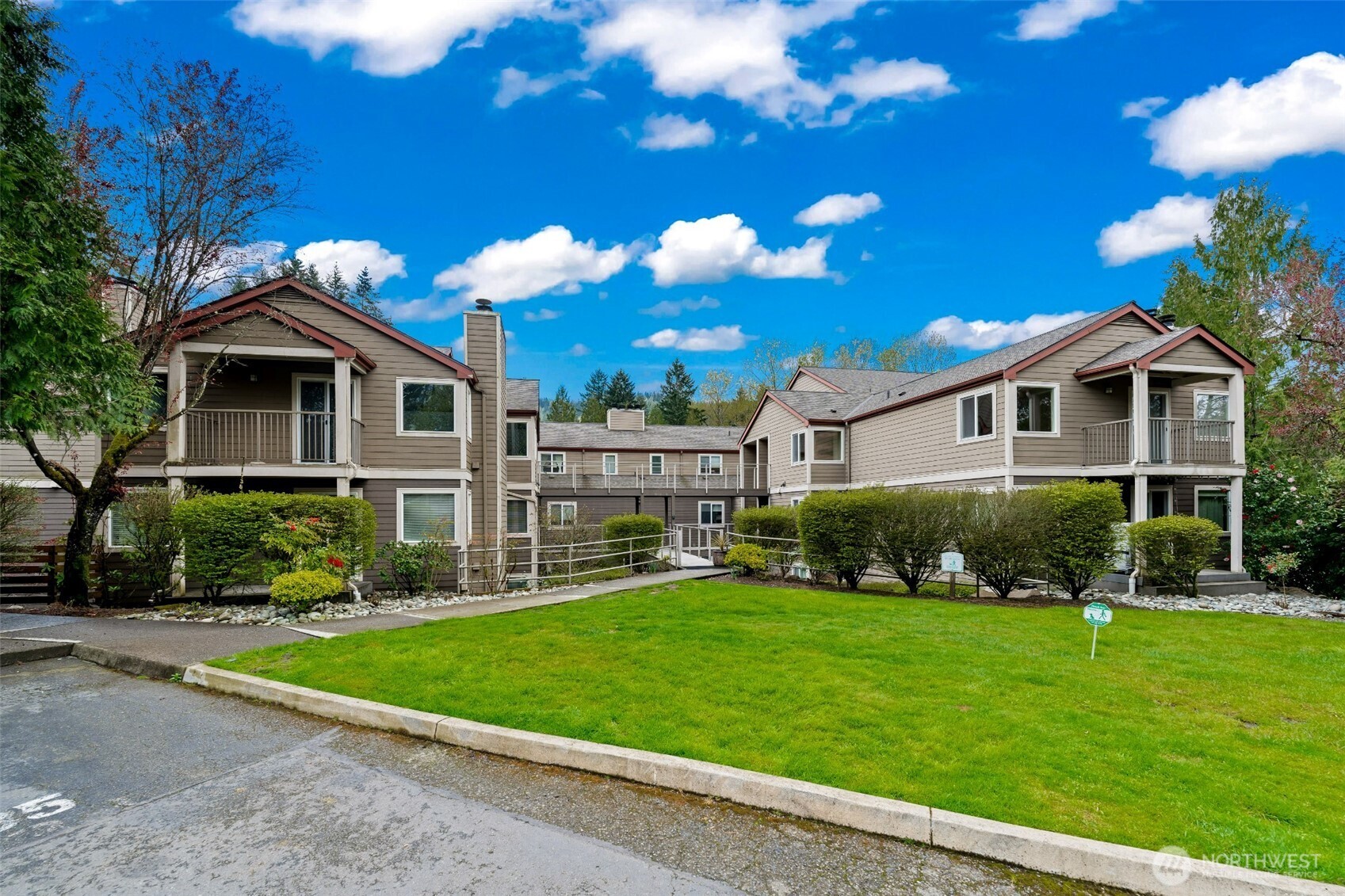 Enjoy the best of Issaquah living in this light-filled, beautifully remodeled 1-bedroom condo in Arrington Place, just moments from Downtown Issaquah. The open-concept layout features a spacious kitchen and dining area that flows seamlessly into a bright living room with a cozy wood-burning fireplace and patio—perfect for relaxing or entertaining. Fresh interior paint, brand-new carpet, and newer washer, dryer, and water heater offer modern comfort and peace of mind. The generous bedroom, full bath, and versatile in-unit storage space add to the home’s functionality, while covered parking and additional on-site storage provide everyday convenience. Step outside to enjoy Front Street’s charming shops, dining, and performances at Village Theatre, along with easy access to hiking trails and local events like Issaquah Salmon Days. Community amenities include a clubhouse, fitness room, and hot tub, all within a well-managed HOA with no rental cap and no history of special assessments, plus access to award-winning Issaquah schools.