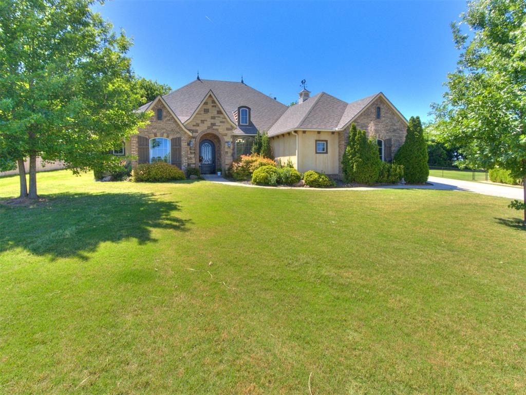 Stunning custom home on a spacious 1/2-acre lot offering exceptional craftsmanship and upscale finishes throughout. This 3-bedroom, 2.5-bath home features an open-concept layout with tall ceilings, rich African mahogany wood floors, oversized crown molding, and solid 8-foot wood doors. The chef’s kitchen is equipped with granite countertops, stainless steel appliances, a 6-burner gas cooktop, and double ovens — perfect for entertaining. The spacious living area showcases a dramatic rock fireplace with built-in shelving, while the private study with French doors provides the ideal work-from-home space. Relax in the luxurious primary suite featuring a jetted tub, walk-in shower, and beautiful custom tile work. Enjoy peaceful Oklahoma sunsets from the covered patio and take in the elevated views overlooking downtown OKC. Conveniently located with quick access to West Norman, Newcastle, and OKC.
