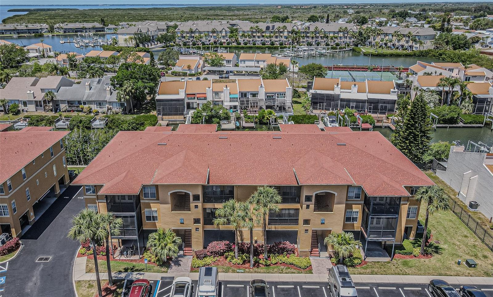 This top-floor, 2-bedroom, 2-bathroom condo in the gated Beachwalk community features a split floor plan that has been entirely refreshed with new interior paint. The open living and dining area connects directly to a private screened balcony, while the practical kitchen is anchored by a suite of brand-new appliances, eliminating the need for immediate upgrades. The layout includes convenient in-unit laundry and two primary suites, each with its own walk-in closet.The Beachwalk community provides a low-maintenance lifestyle with comprehensive amenities, including a resort-style pool, fitness center, clubhouse, and a private boardwalk winding through a mangrove nature preserve. Positioned just off Memorial Highway, the property offers immediate access to the Veterans Expressway, placing Tampa International Airport and the Westshore Business District just minutes away.