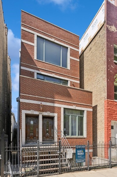 Stunning 3-bed, 2.5-bath, 2400 sq.ft. duplex down in vibrant Wicker Park! This spacious condo features a generous main level with an open-concept entertaining area, perfect for a dining table and entertainment space, complete with a fireplace. Downstairs, enjoy a cozy and very spacious family room, also featuring its own fireplace. Highlights include high ceilings, hardwood floors, plush carpet, and tile downstairs. The beautifully appointed kitchen boasts granite countertops, stainless steel appliances, and an eat-in area. Relax in large bedrooms with double vanities, two jacuzzi tubs, and a FULL CEDAR SAUNA. Additional features include a tankless water heater, central vacuum, and a laundry room with a full-size washer, dryer, and basin, plus ample storage.    Step outside to four outdoor spaces, including a beautiful garage-top deck, front/back patios, and a downstairs outdoor storage area perfect for furniture or other large items resilient to Chicago winters. One garage parking space is included, with easy street parking available. Located steps from Wicker Park/Bucktown's best-restaurants, bars, The 606, and shopping (Jewel, Aldi, Mariano's, Target). Close to Blue Line, Metra, and major highways (90/94, 290). Built in 2004, this condo blends luxury and convenience in an unbeatable location!