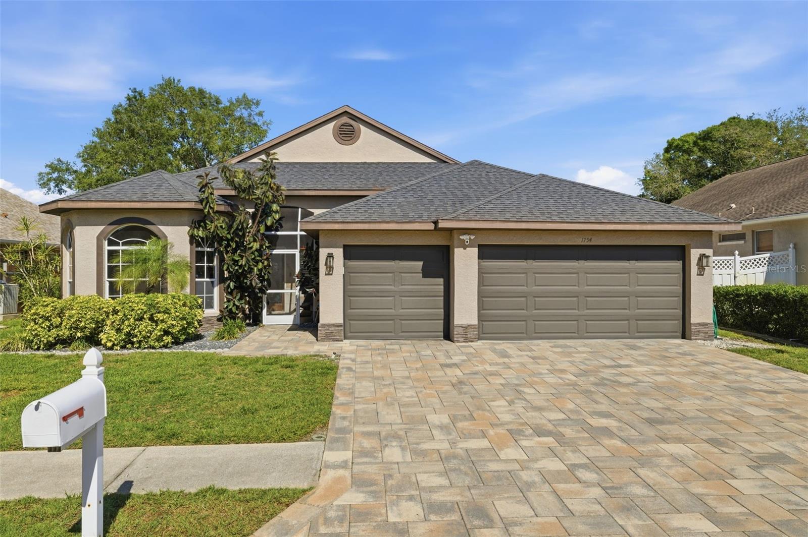 One or more photo(s) has been virtually staged. Welcome Home to 1754 Wood Brook St, Tarpon Springs, FL 34689. Nestled in the Forest Ridge community within a 24 hour security gate, this fully upgraded and renovated 4 bedroom, 2 bathroom home will amaze and touch the discriminating buyer. Every square foot of this home has been upgraded and renovated by a team of design professionals. As you pass through the entryway, you will observe a tranquil sitting area with custom glass door. As you enter the home, notice the regal high vaulted ceilings graced with fans and the most amazing interior design patterns you will see in the entire neighborhood. No cost has been spared in the design of this stunning house. The formal dining area is flanked by the custom kitchen with stone countertops and wood cabinets. The matching stainless steel appliances will serve all your cooking needs in style! Stride into your custom family room with in-wall electric fireplace. As you enter the covered patio, you'll be sure to enjoy many soaks in your custom private pool. The primary bedroom is a tour in indulgence! A large soaking tub, dual sinks, separate stall shower with sitting bench and a custom cabinet-enclosed walk-in closet are attached en suite to the primary bedroom. The second bedroom, crafted with wall to ceiling windows can serve as a bedroom, office, or gym! The third and fourth bedrooms on the opposite side of the house flank the second bathroom. The large attached garage conveniently opens into the laundry room. This is the dream home you have been looking for and there is not another home like this in the entire neighborhood. Yes, this is the one for you! Now that you've read the description and seen the pictures, come and see this one-of-a-kind home. You can have a luxury interior designed home for an affordable price. Statements and measurements are believed accurate by Seller/Agent, however they cannot be guaranteed. Buyer and Buyer's agent must confirm all statements and measurements for themselves. This description can't possibly tell you everything about your future home. You simply must see the home portal website, video, and 3D walk through connected to this listing. Schedule a showing with your agent or contact the listing agent for a showing. Showings are by appointment only. What are you waiting for? Your future house is waiting for you to come home.